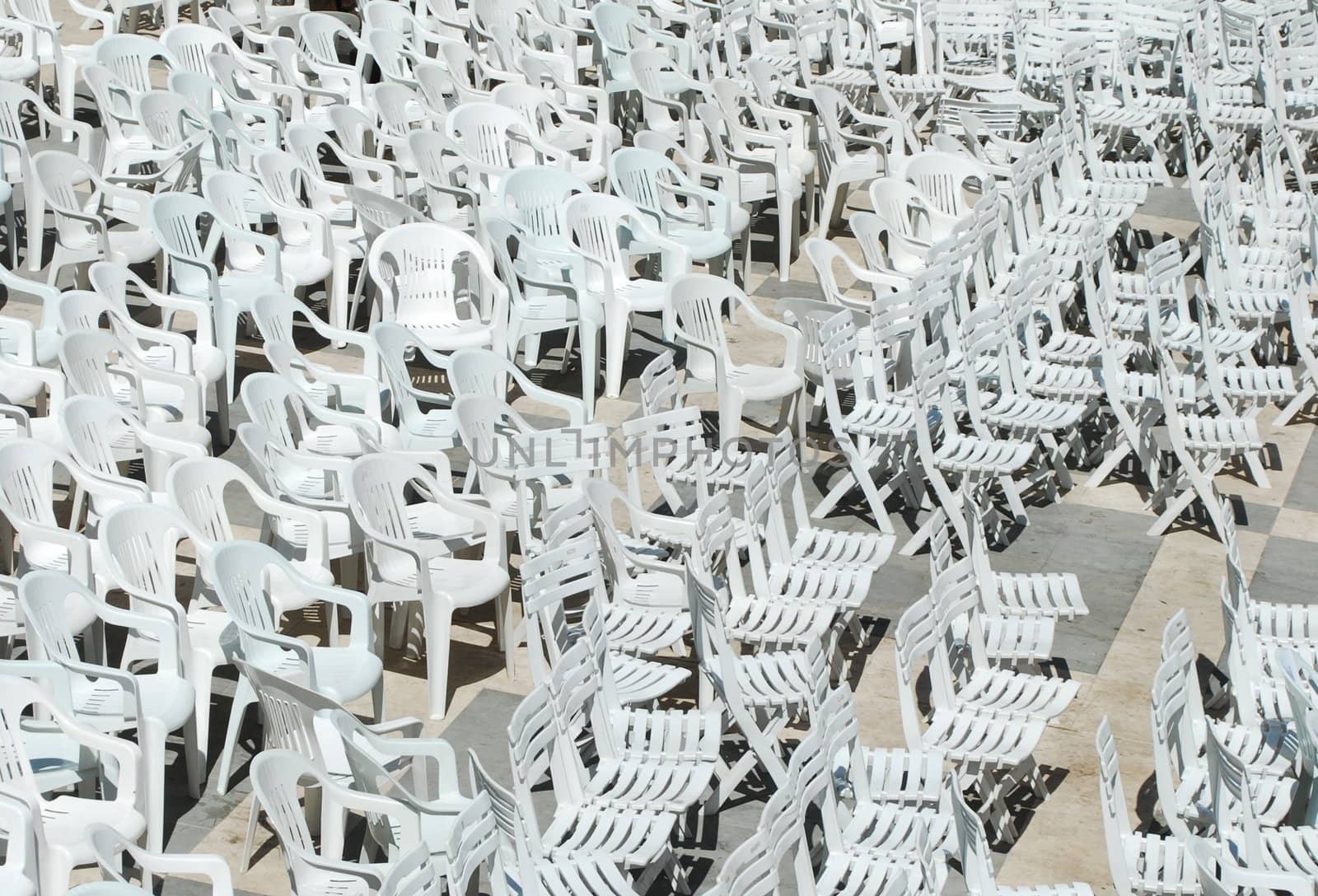 White plastic chairs background by luissantos84