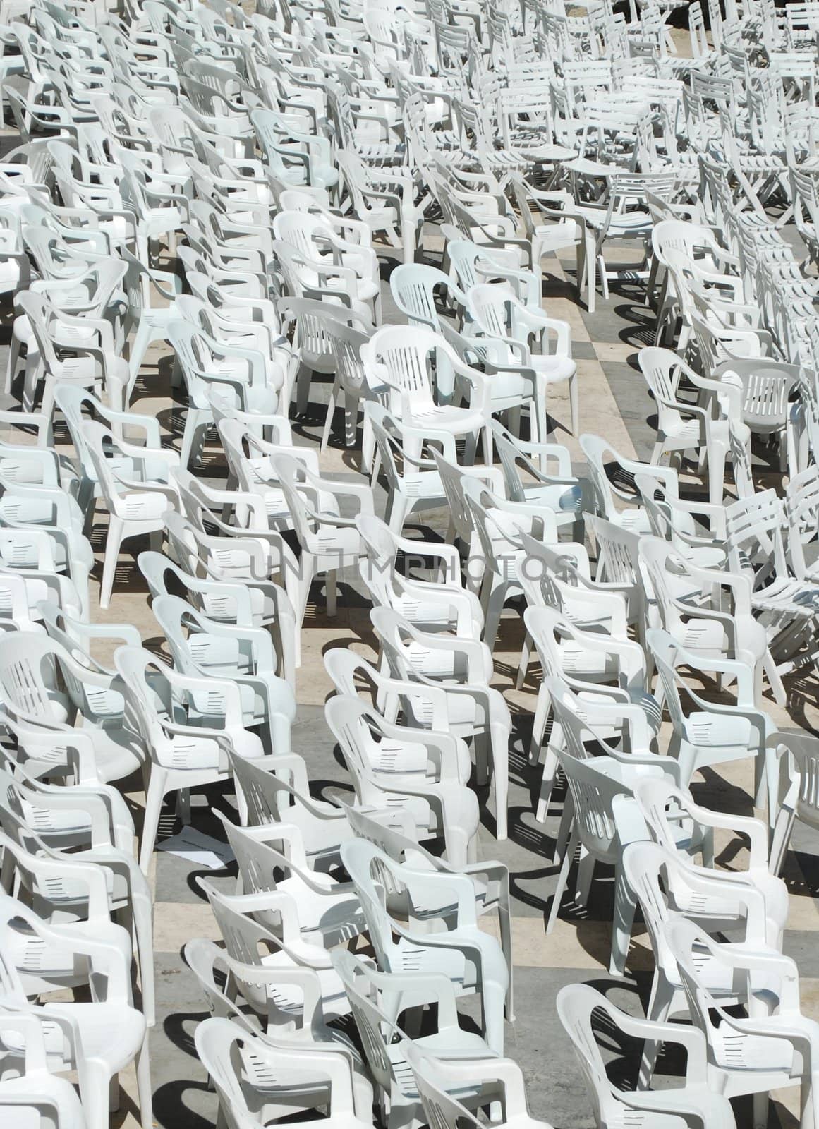 White plastic chairs background by luissantos84