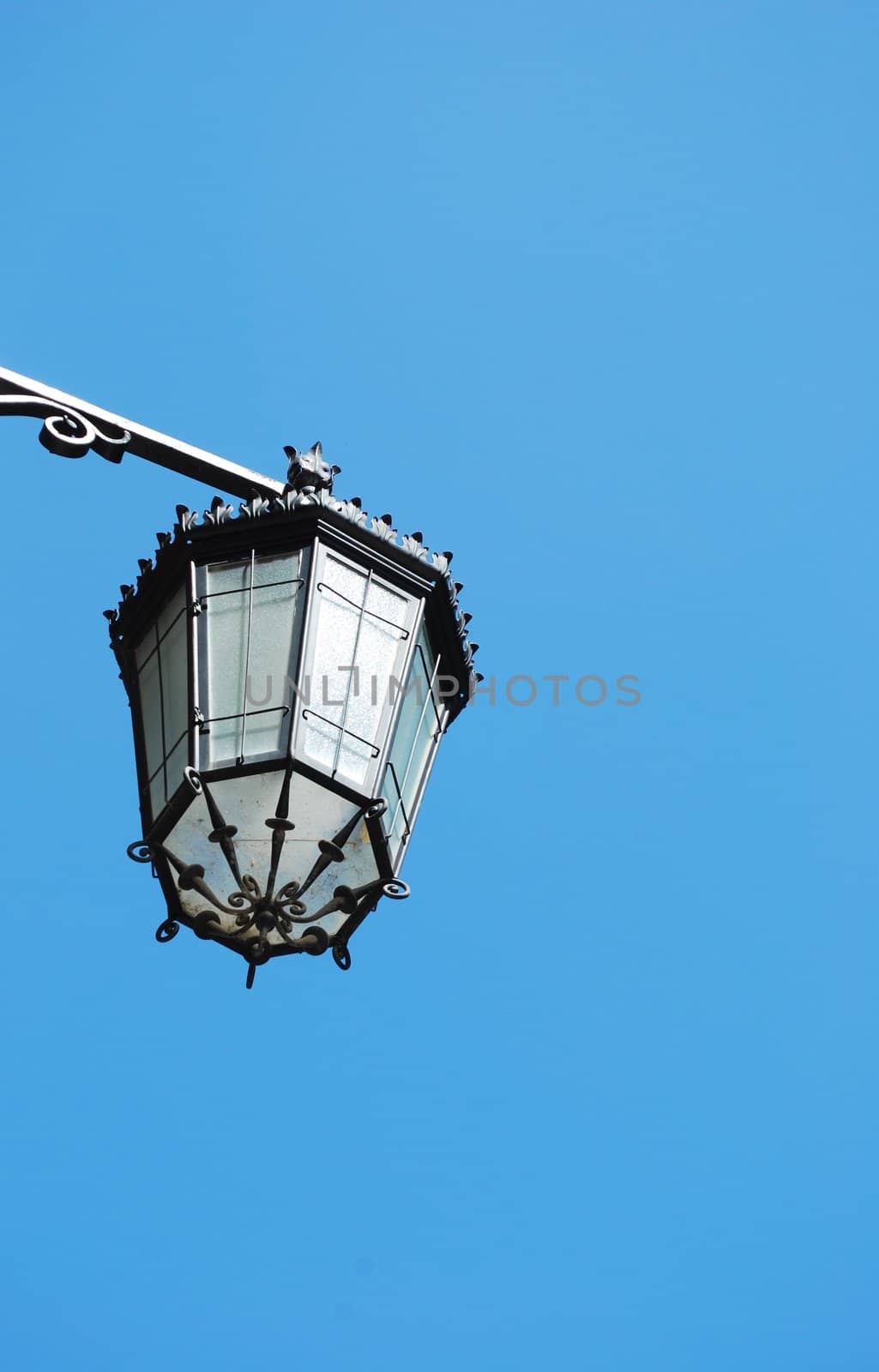 old vintage lantern against blue sky background