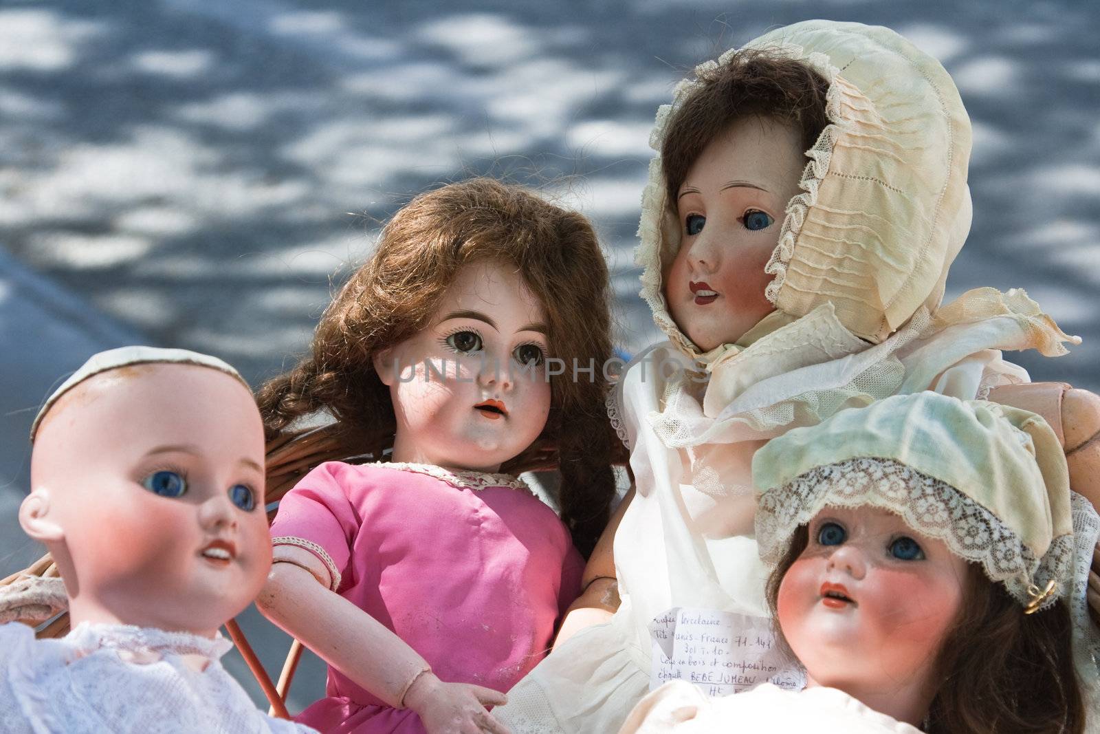 Antique dolls at a outdoor Paris flea marketgg