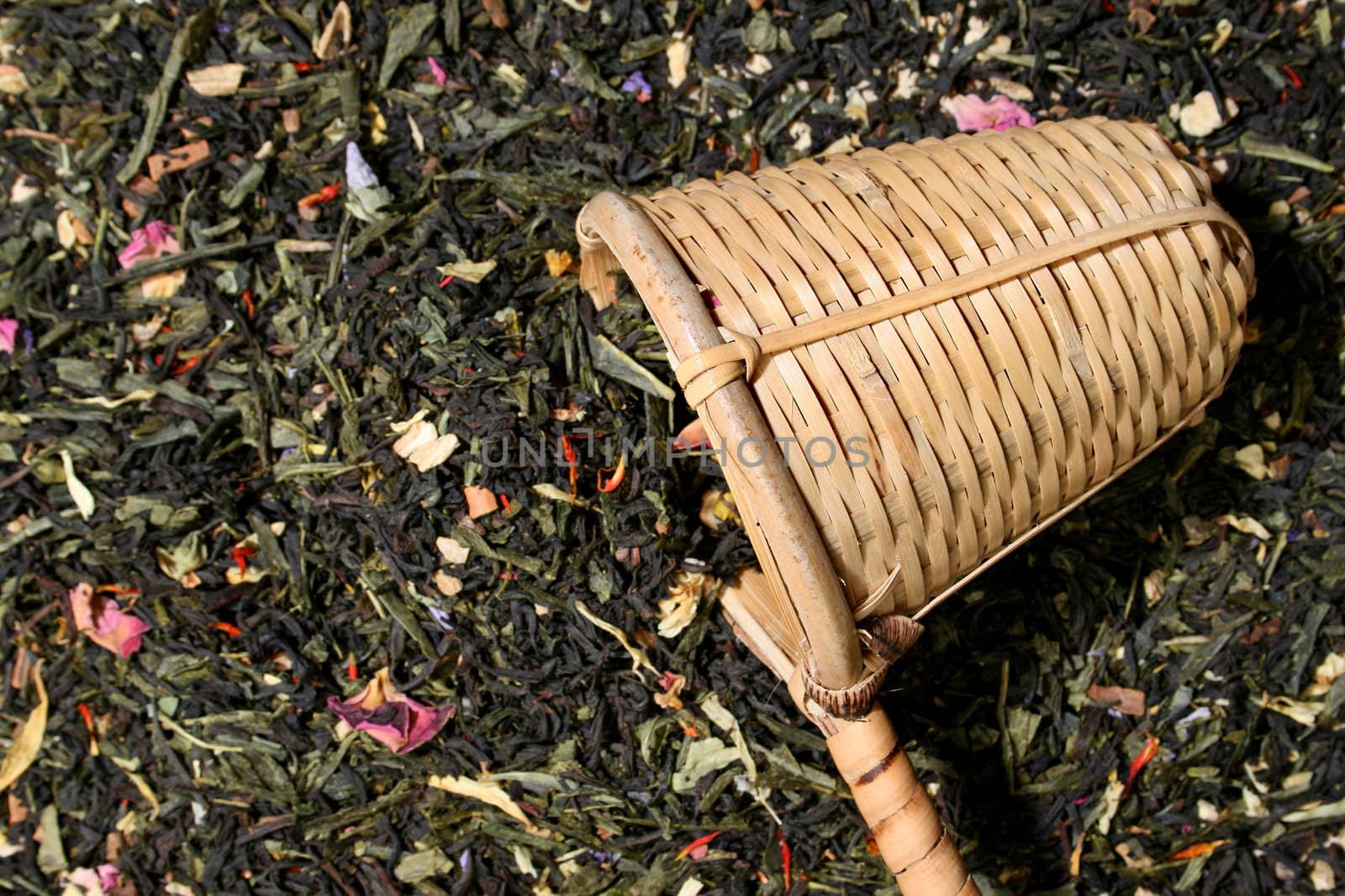Wicker scoop over a tea leaves background, more in my gallery