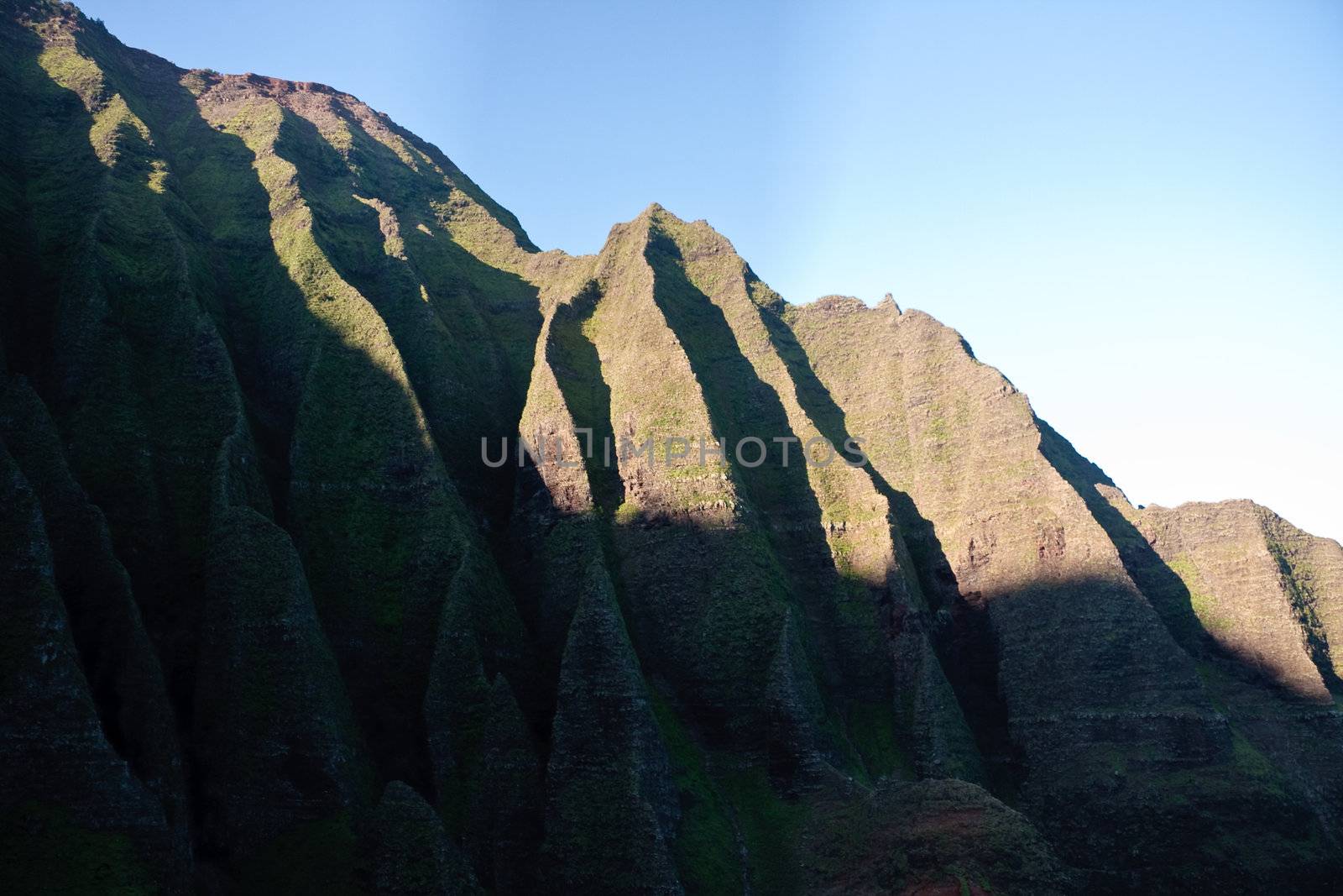 Wrinkled cliff face on Na Pali coast in Kauai by steheap