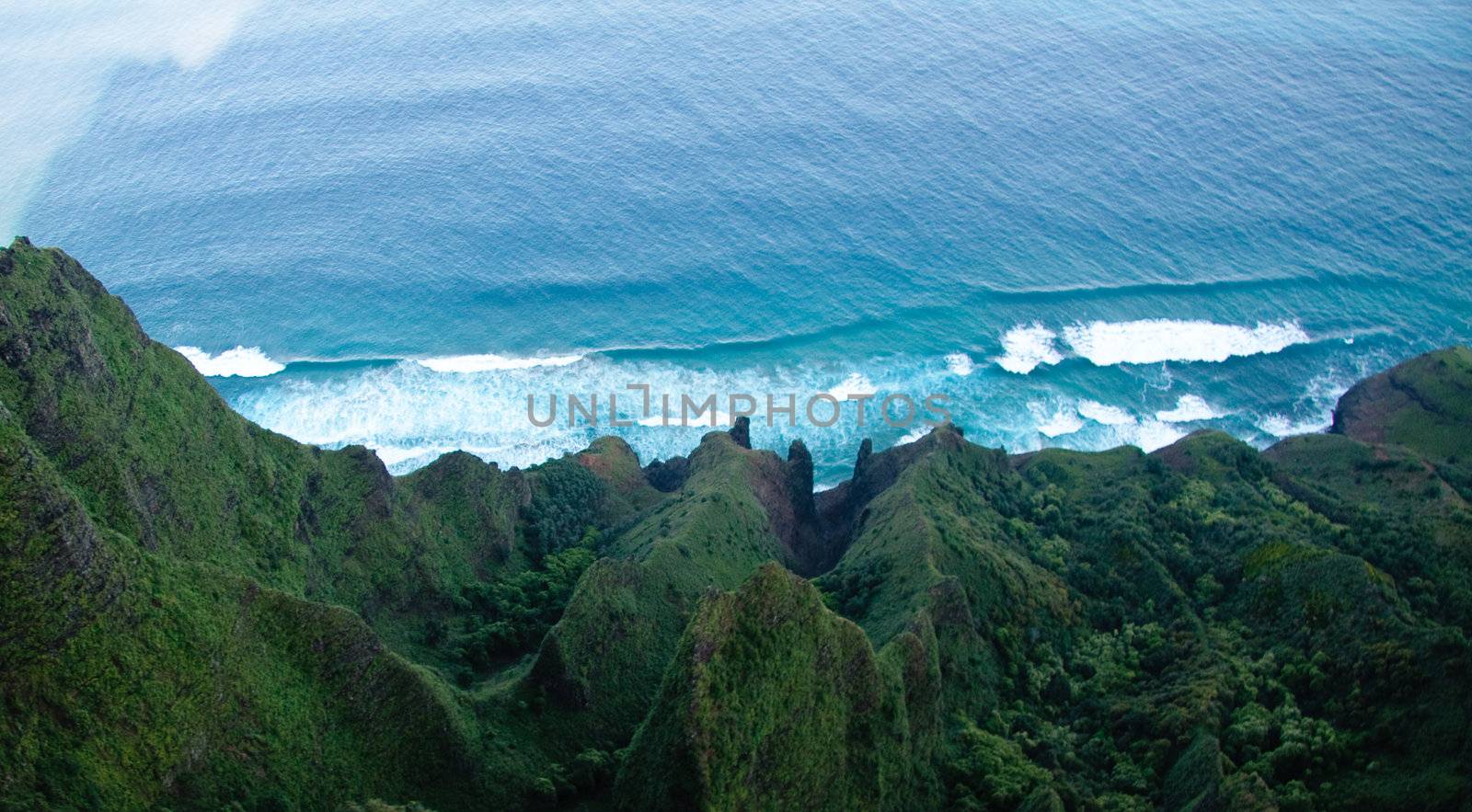 Aerial view down the Na Pali coastline in Kauai by steheap