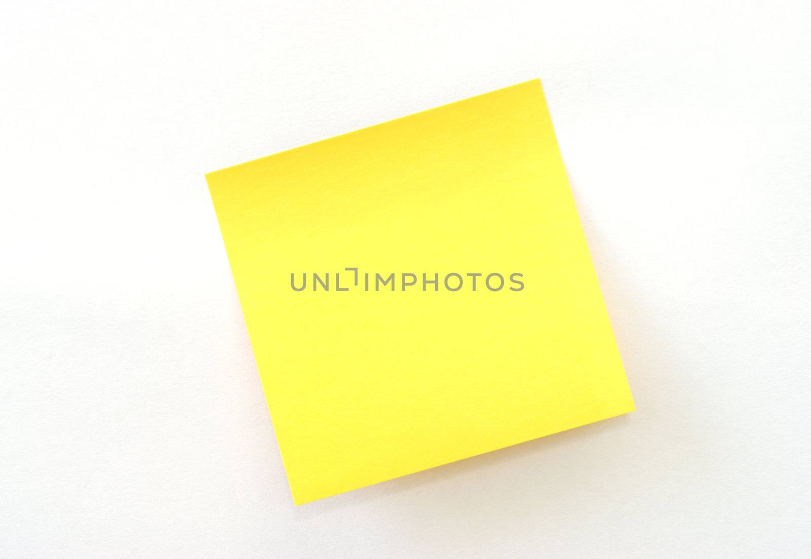 An isolated yellow sticky note on white background.