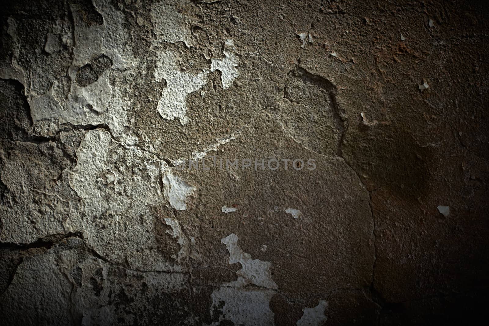 Grunge cement wall with dramatic light by pashabo