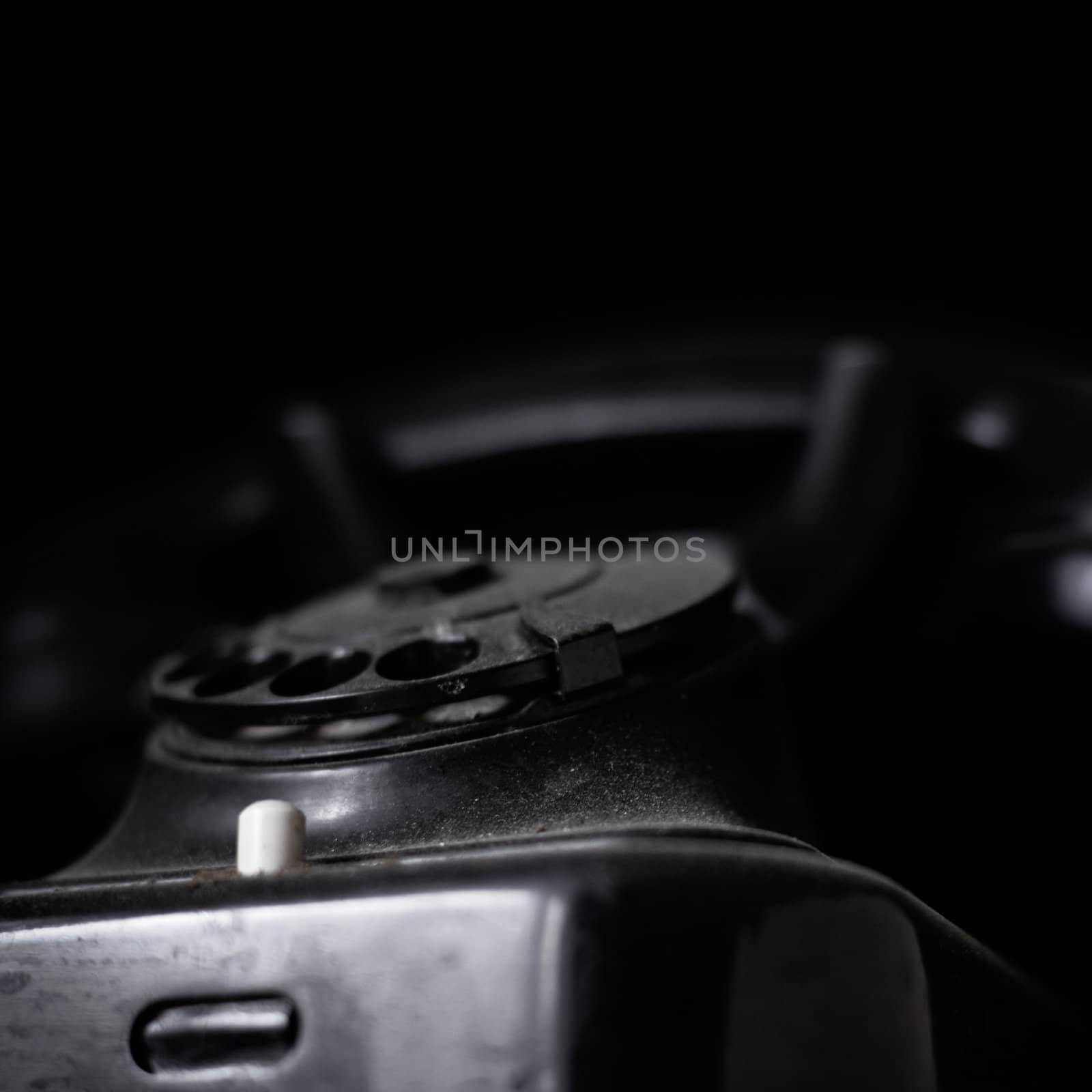 Vintage dusted phone on dark background, with copyspace. by pashabo