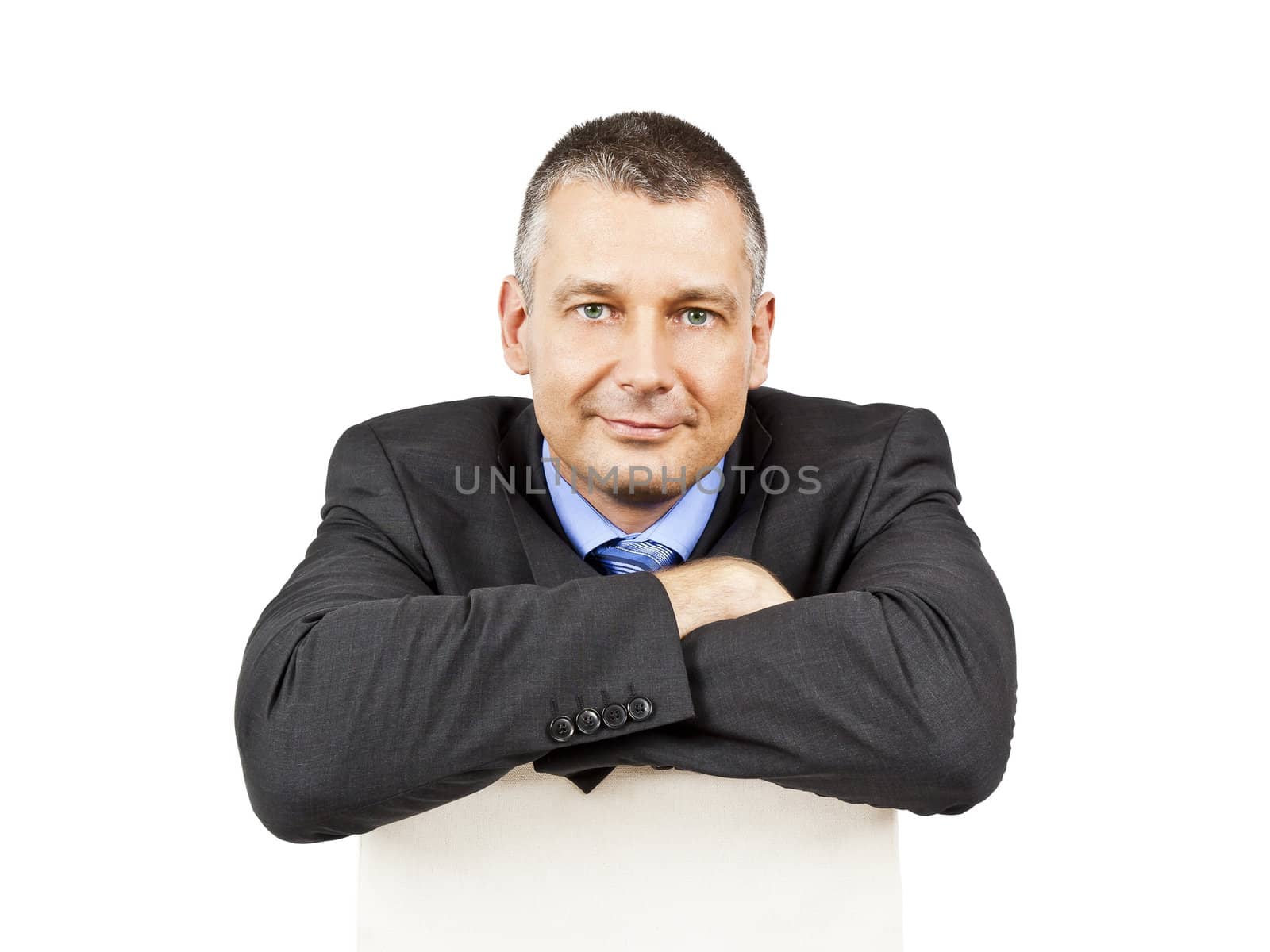 An image of a sitting business man smiling