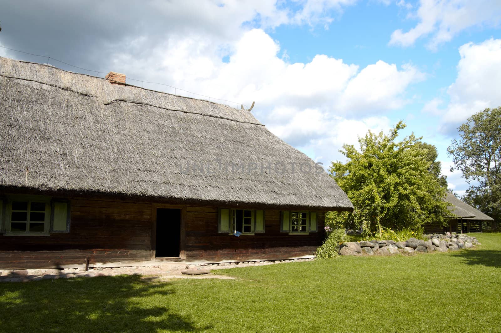 The old nineteenth century Lithuanian built house with straw roof 