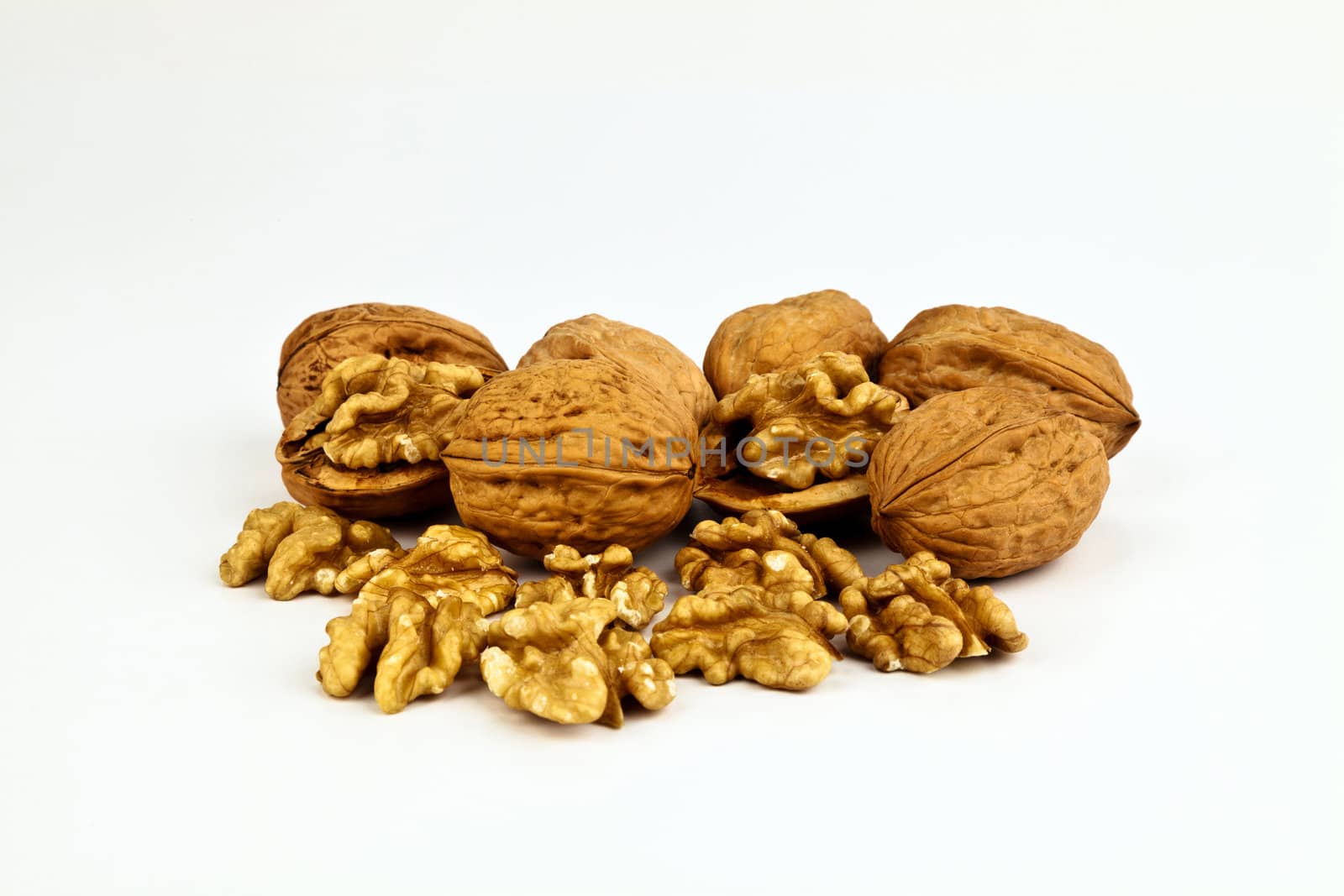 Beaufiful composition of a group of nuts on white background.