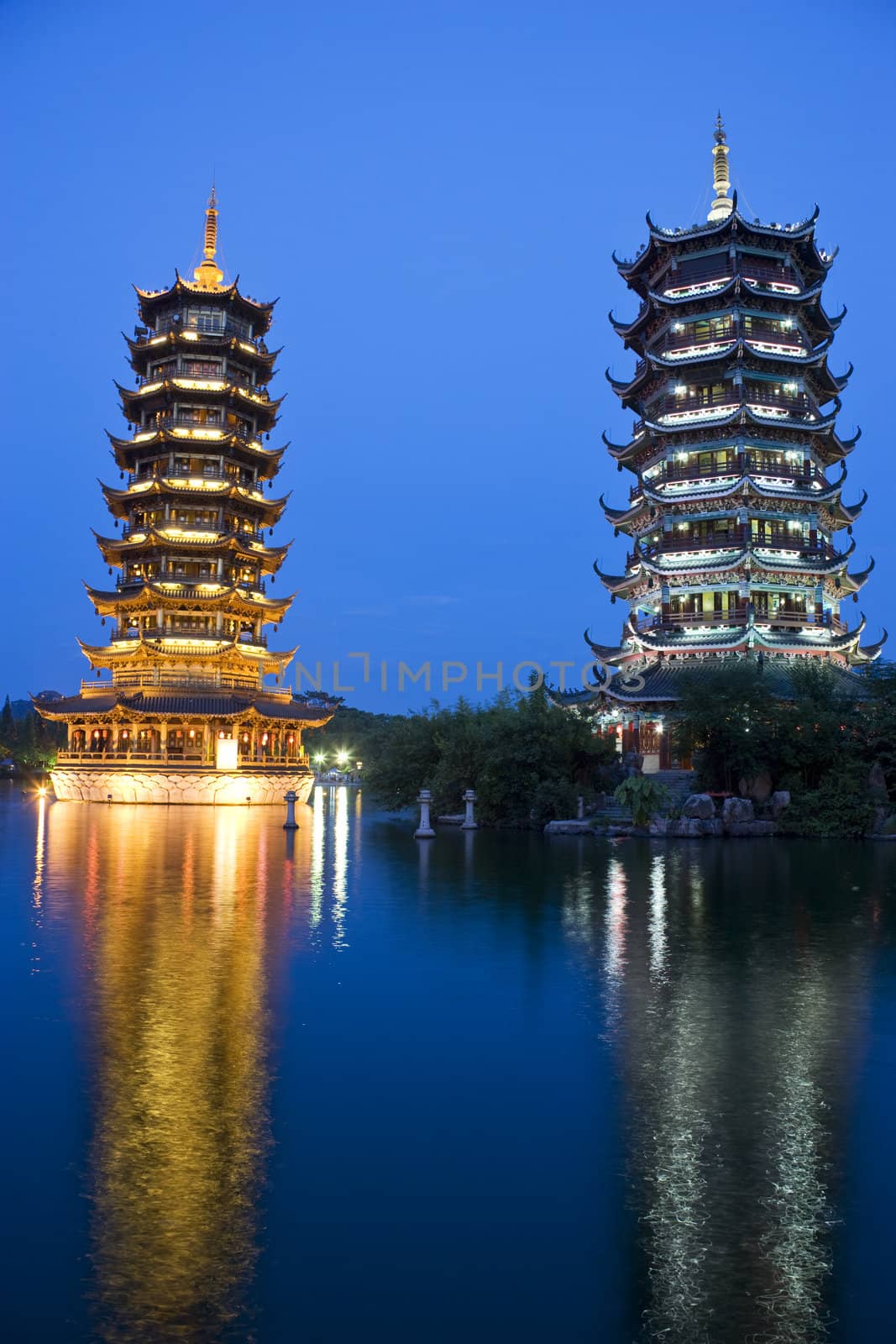 Night image of the Sun and Moon Pagodas at Guilin, China.