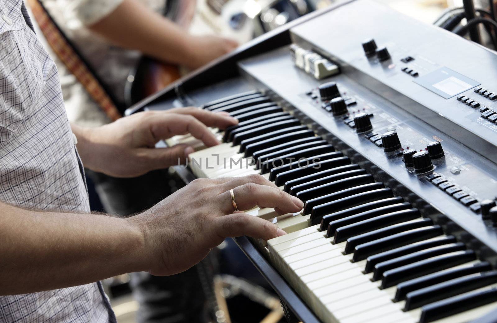 The man plays on an electric piano