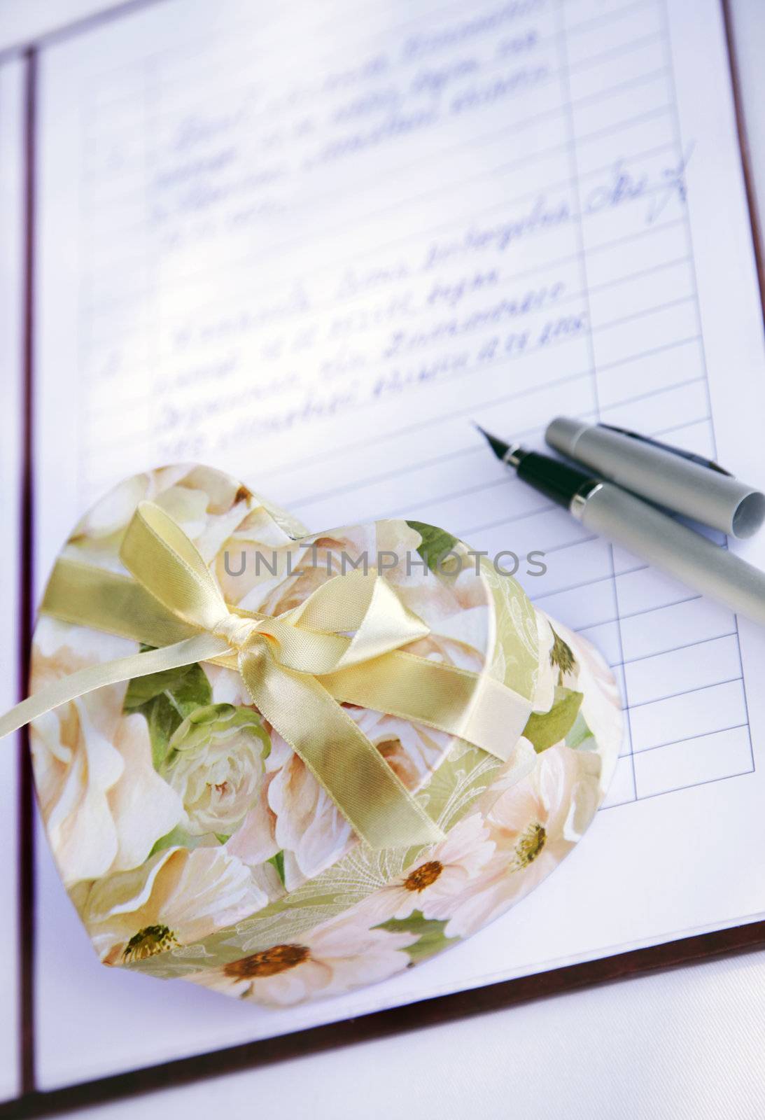 Gift box as heart and the wedding contract