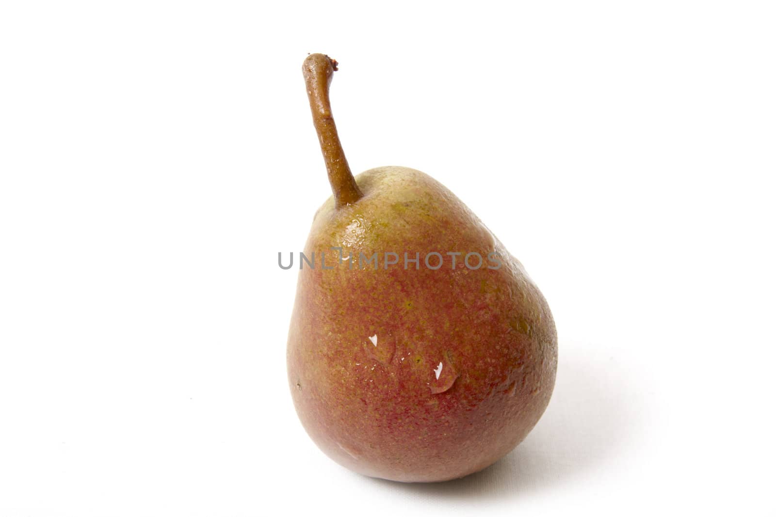 Pear in drops isolated on white background