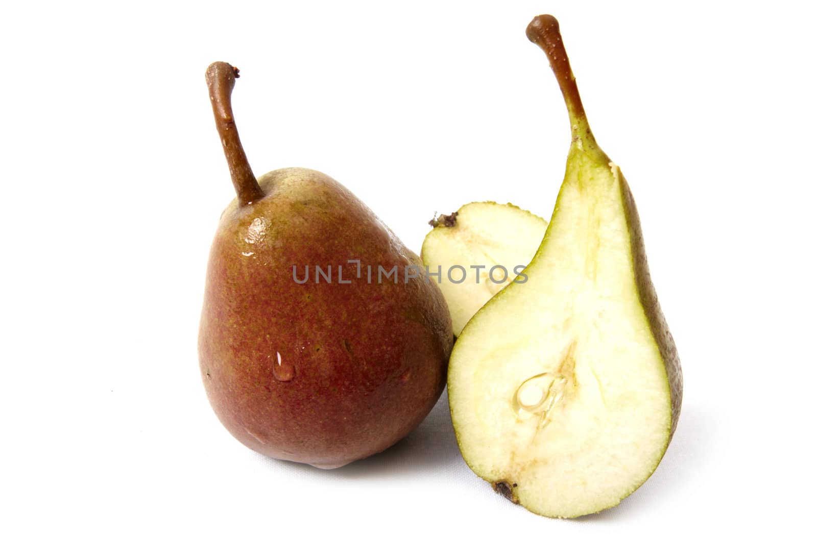 Sliced ripe pear isolated on white background. Photo taken in august, 2009