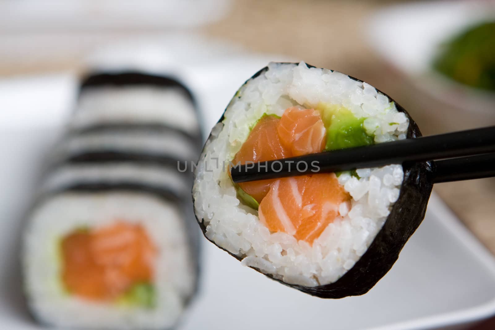 Fresh japanese salmon sushi served on a white plate