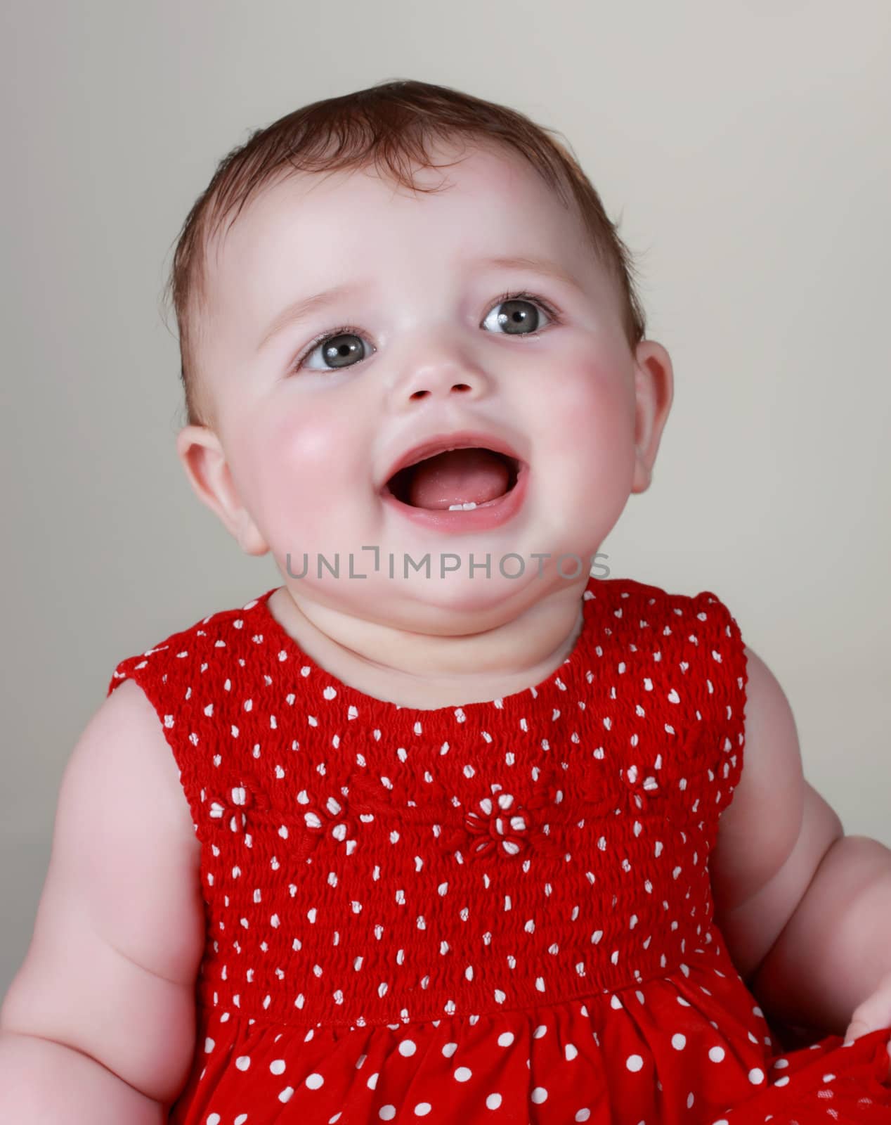 portrait of a cute happy caucasian baby girl