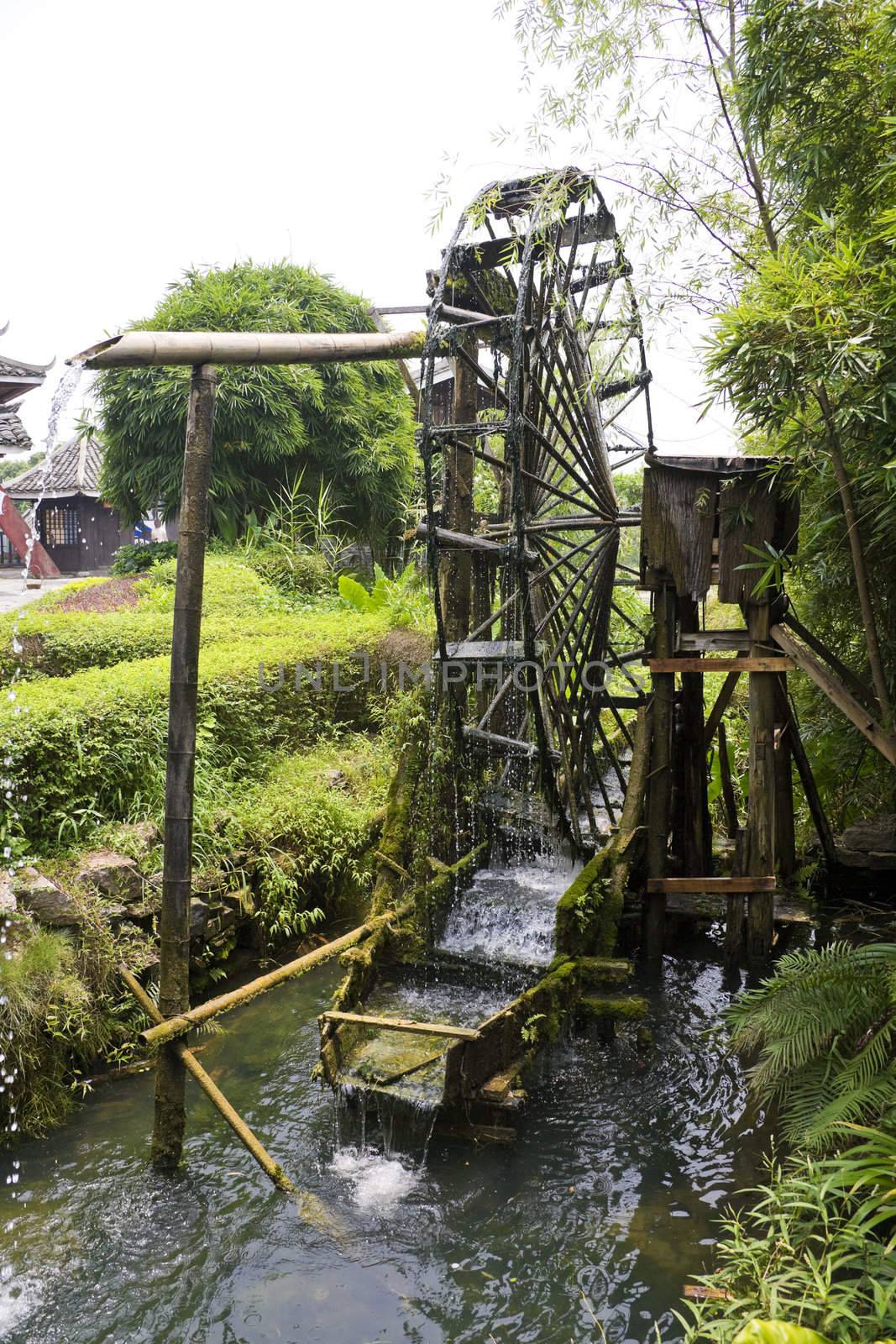 Image of a paddy farmer's water wheel irrigator at Guilin, China.
