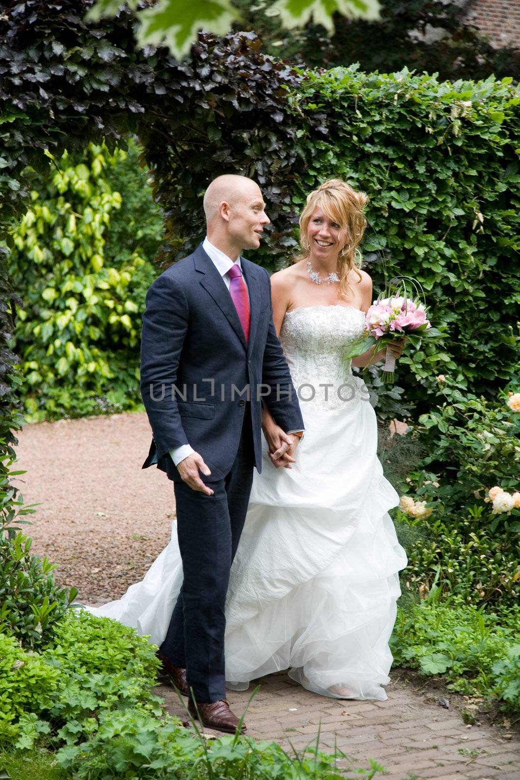 Beautiful bride and groom walking towards the altar