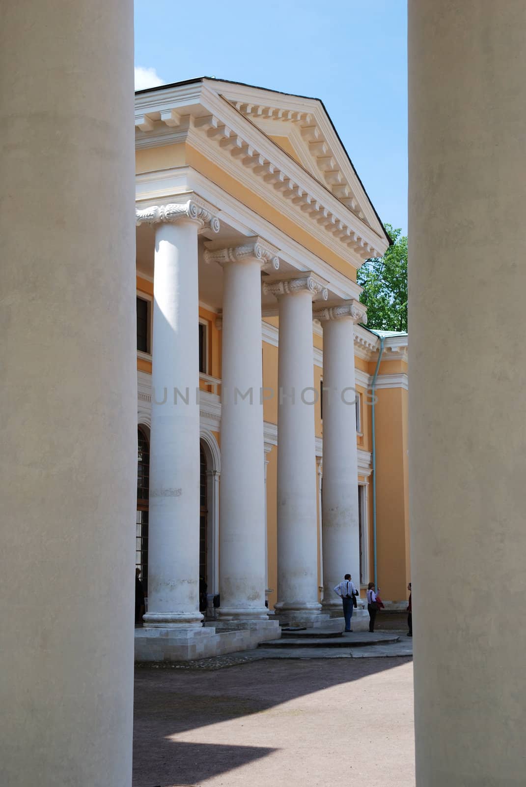 Classical portico with white columns. View from between columns. Arkhangelskoye estate, Moscow, Russia