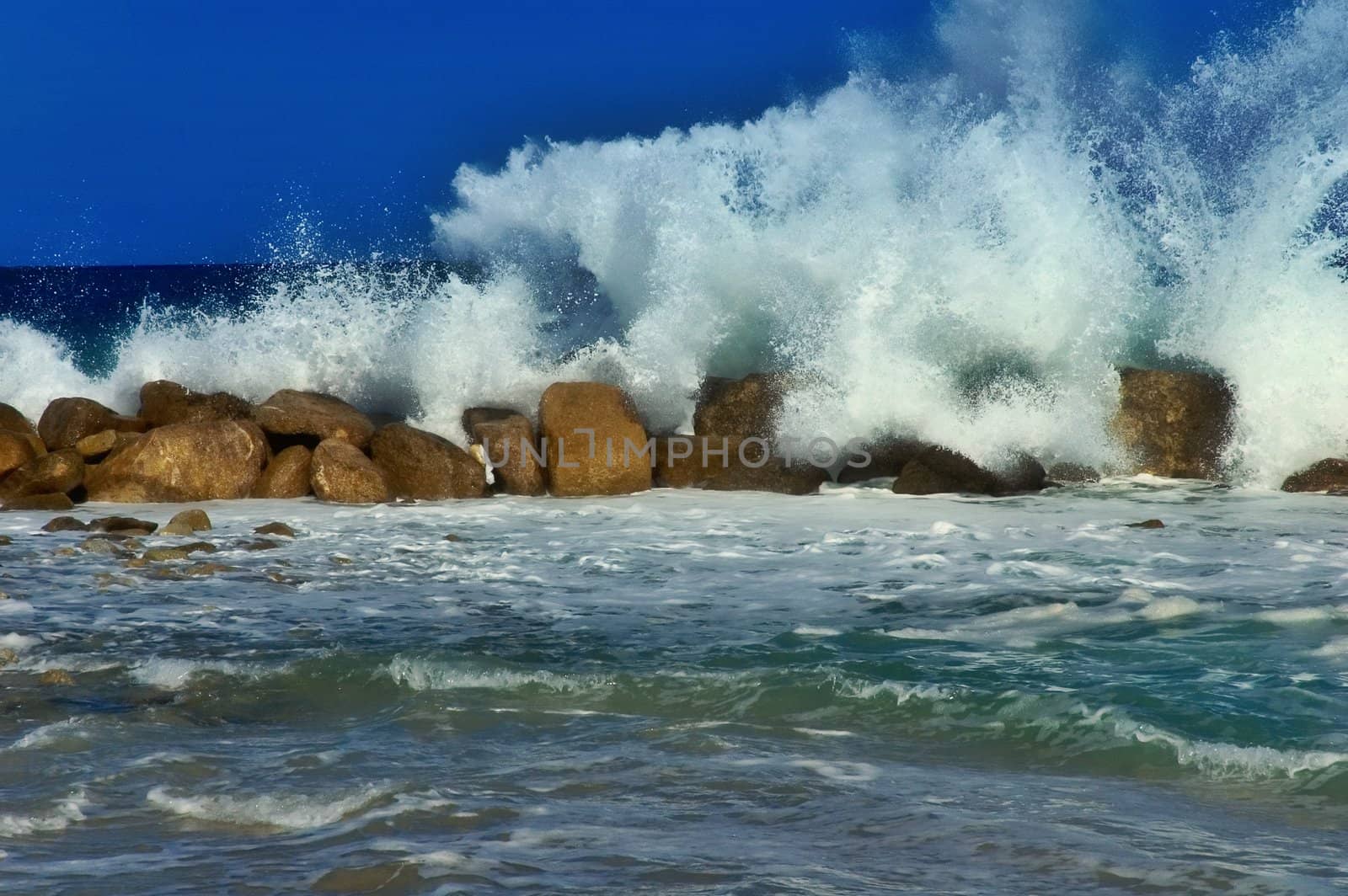 Splashing wave against rocks