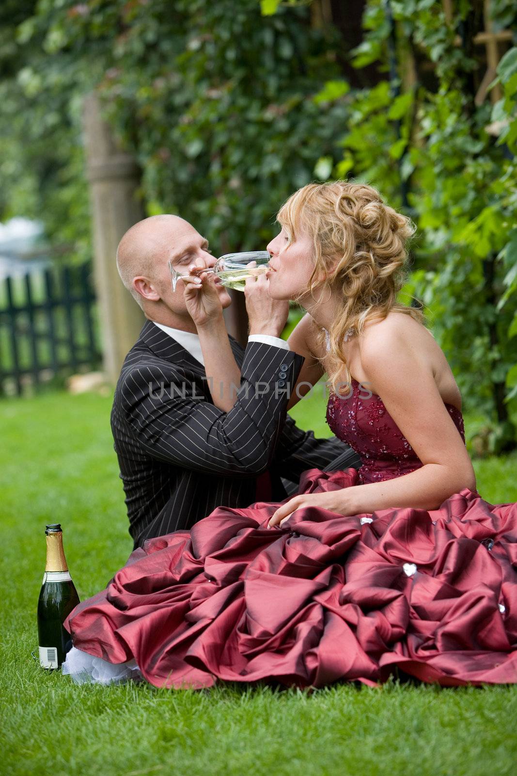 Cute young couple having a drink together outdoors