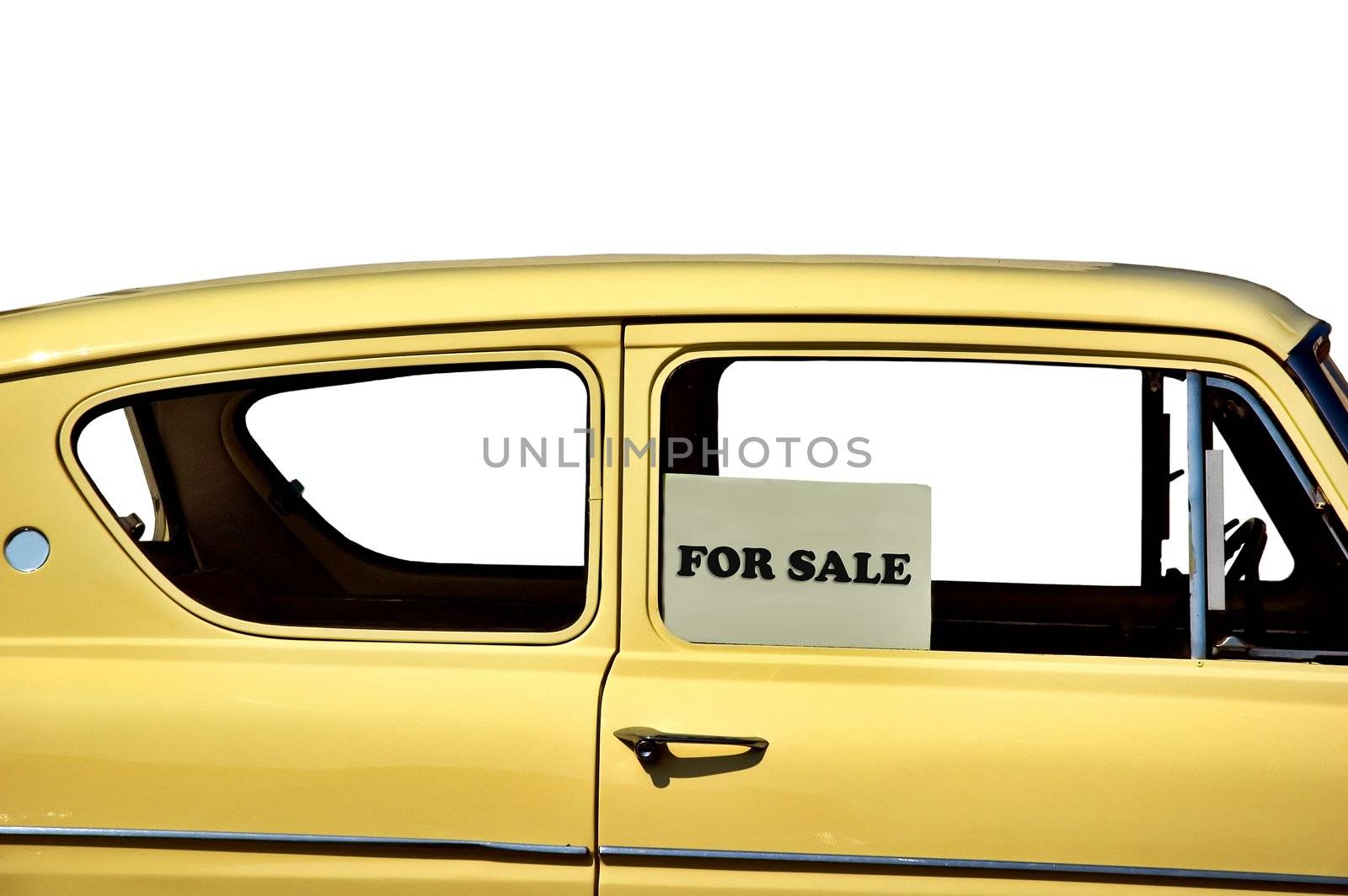 European yellow car detail with for sale sign on window