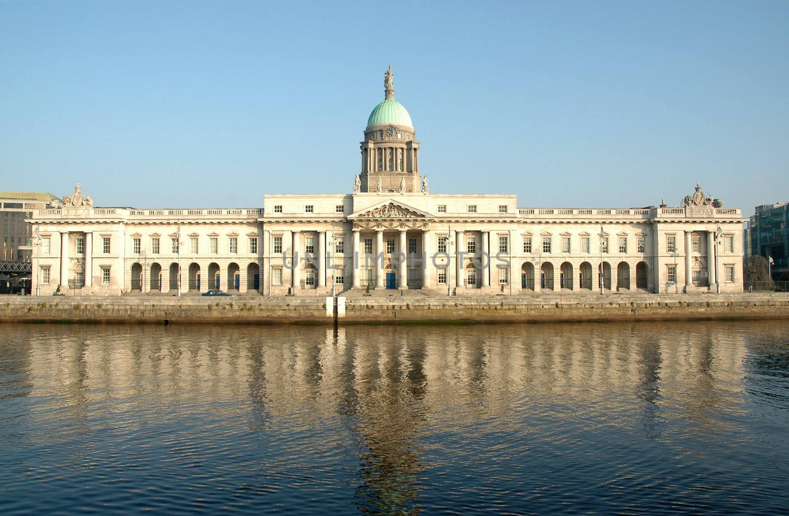 Custom House on the Quays in Dublin. A neoclassical 18th century building which now houses the Department of Environment, Heritage and Local Government. It is located on the north bank of the River Liffey, on Custom House Quay between Butt Bridge and Talbot Memorial Bridge.
It was designed by James Gandon to act as the new custom house for Dublin Port. When it was completed in 1791, it cost �200,000 to build � a huge sum at the time. The four facades of the building are decorated with coats-of-arms and ornamental sculptures representing Ireland's rivers.