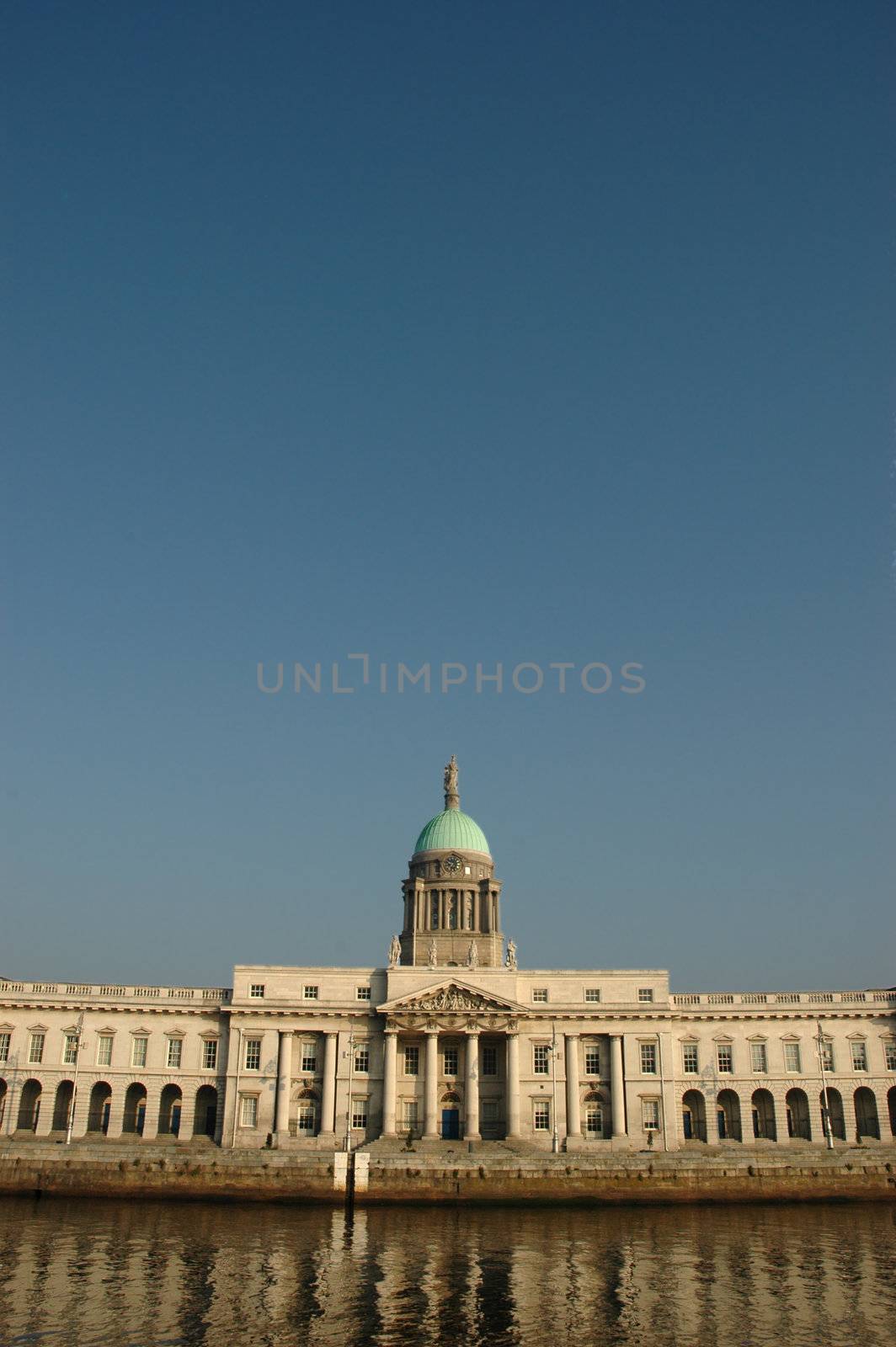 Custom House on the Quays in Dublin. A neoclassical 18th century building which now houses the Department of Environment, Heritage and Local Government. It is located on the north bank of the River Liffey, on Custom House Quay between Butt Bridge and Talbot Memorial Bridge.
It was designed by James Gandon to act as the new custom house for Dublin Port. When it was completed in 1791, it cost �200,000 to build � a huge sum at the time. The four facades of the building are decorated with coats-of-arms and ornamental sculptures representing Ireland's rivers.