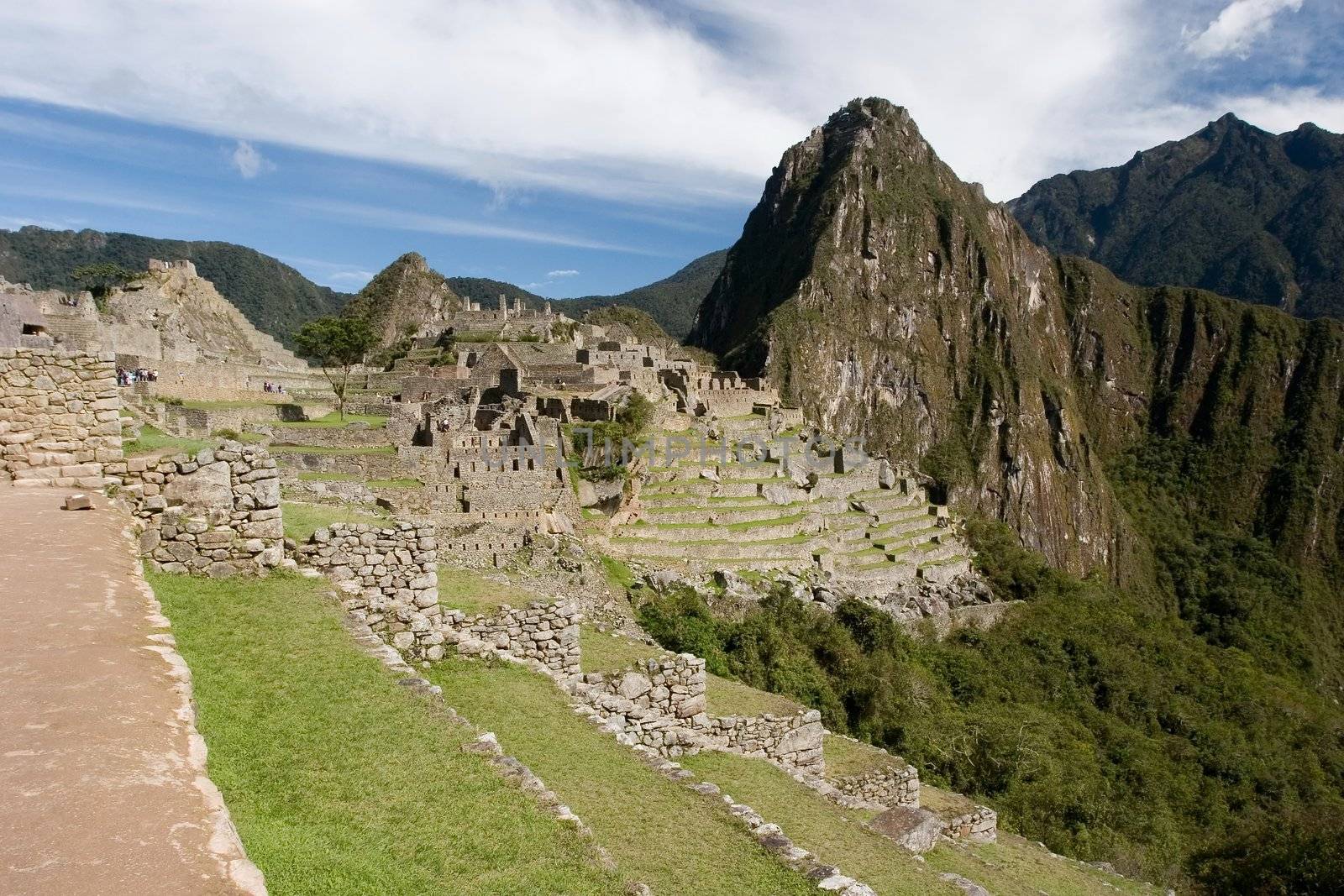 Machu Picchu (Quechua: Machu Picchu, "Old Peak") is a pre-Columbian Inca site located 2,400 meters (7,875 ft) above sea level[1]. It is situated on a mountain ridge above the Urubamba Valley in Peru, which is 80 km (50 mi) northwest of Cusco.