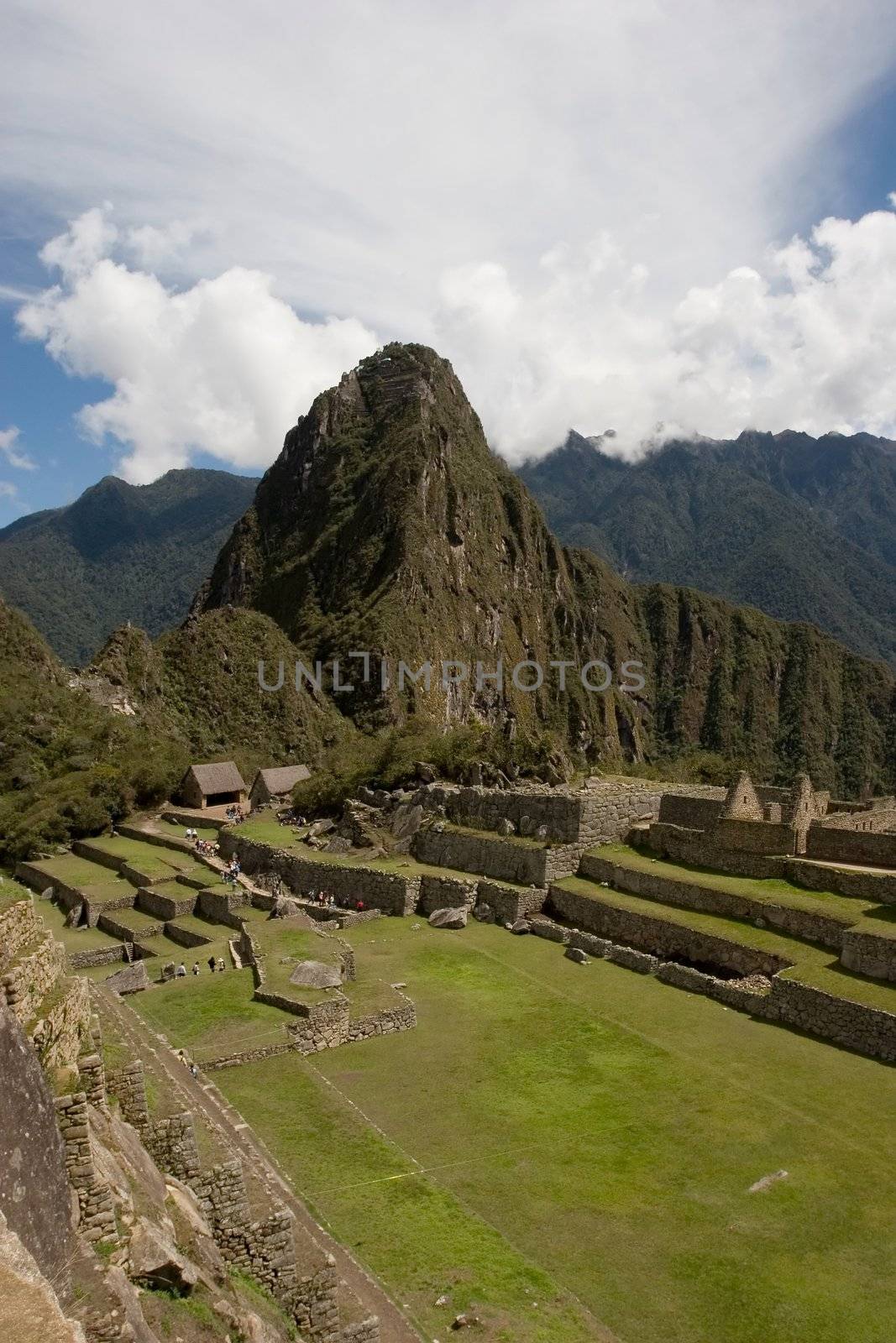 Machu Picchu (Quechua: Machu Picchu, "Old Peak") is a pre-Columbian Inca site located 2,400 meters (7,875 ft) above sea level[1]. It is situated on a mountain ridge above the Urubamba Valley in Peru, which is 80 km (50 mi) northwest of Cusco.