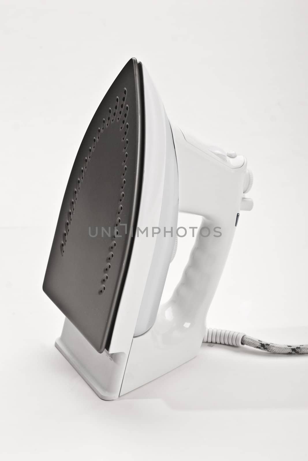 home object: electric iron over white background