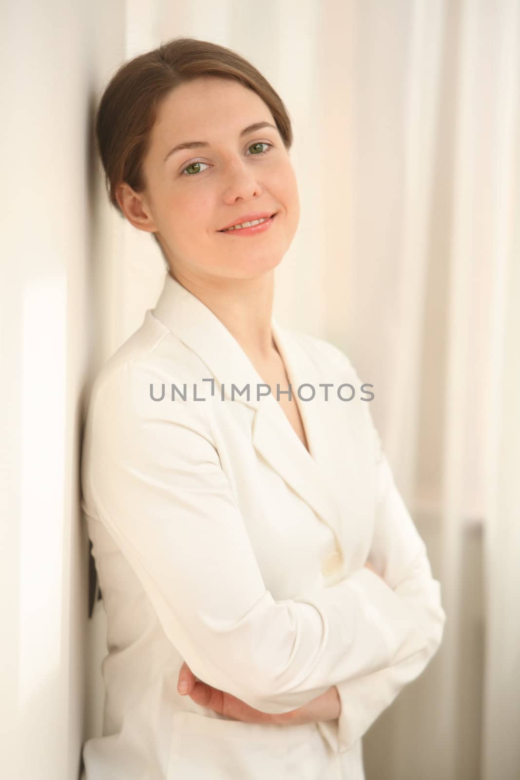 The smiling young woman in a white dressing gown
