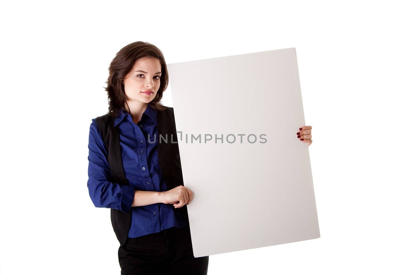 Beautiful young caucasian brunette business student woman standing besides and holding a white blank board, isolated