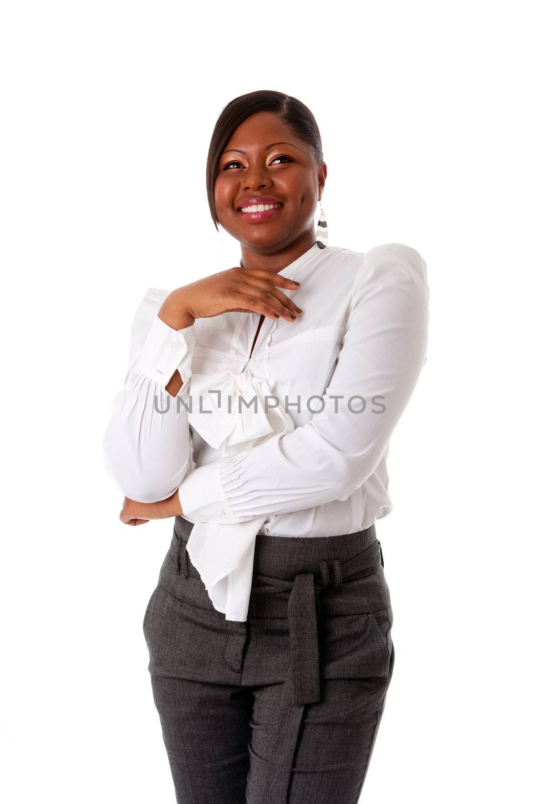 Beautiful African American business woman with attitude dressed in a white shirt and gray pants standing, laughing, isolated