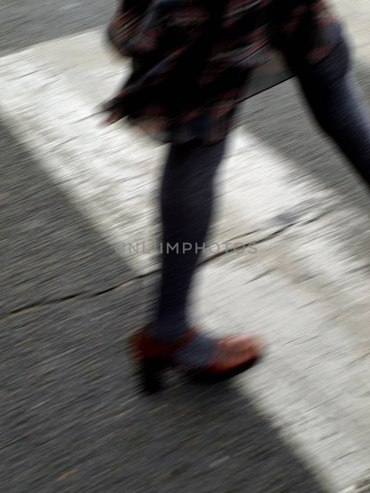 Woman crossing street.       