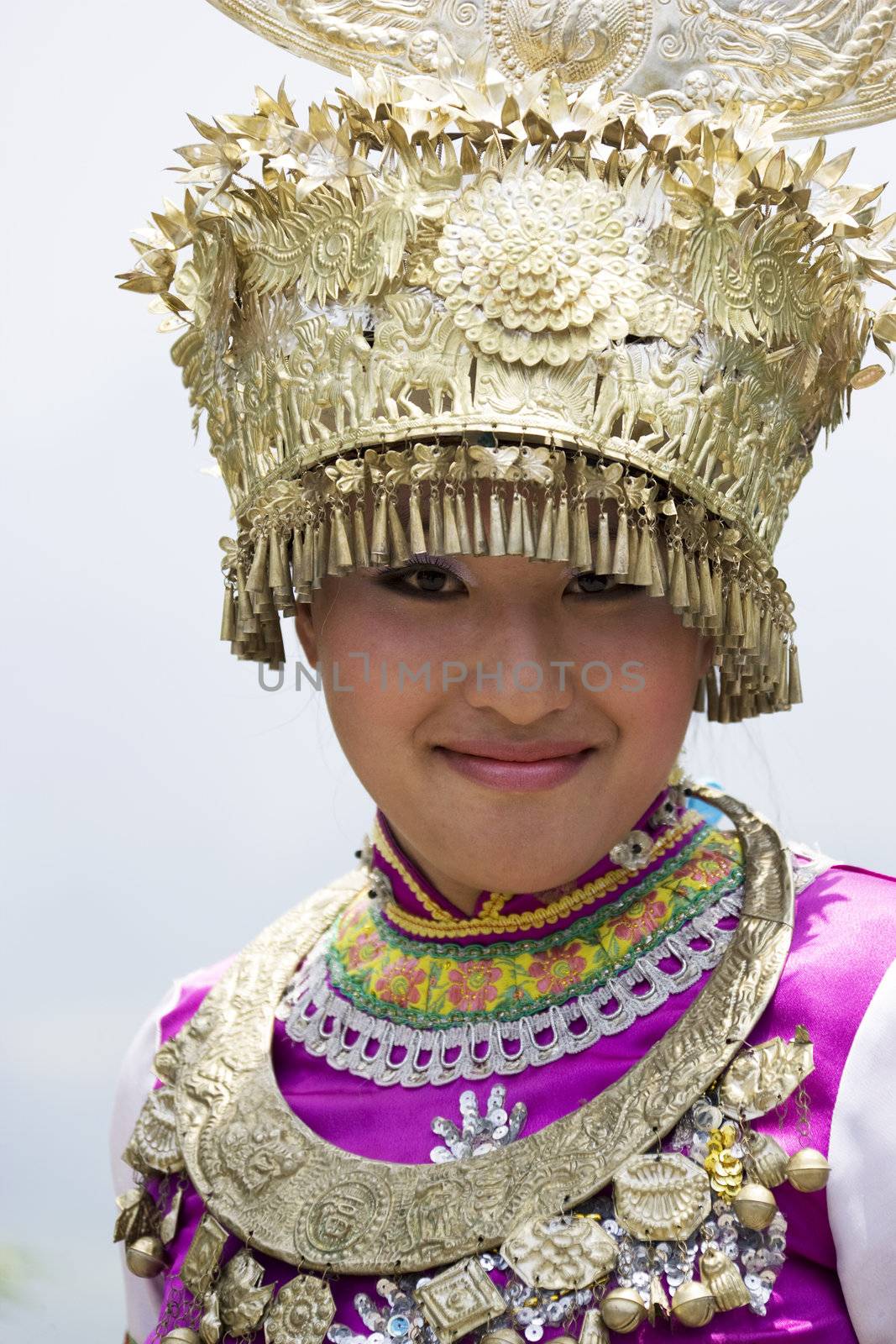 Image of a young Chinese girl in traditional ethnic dress at Yao Mountain, Guilin, China.