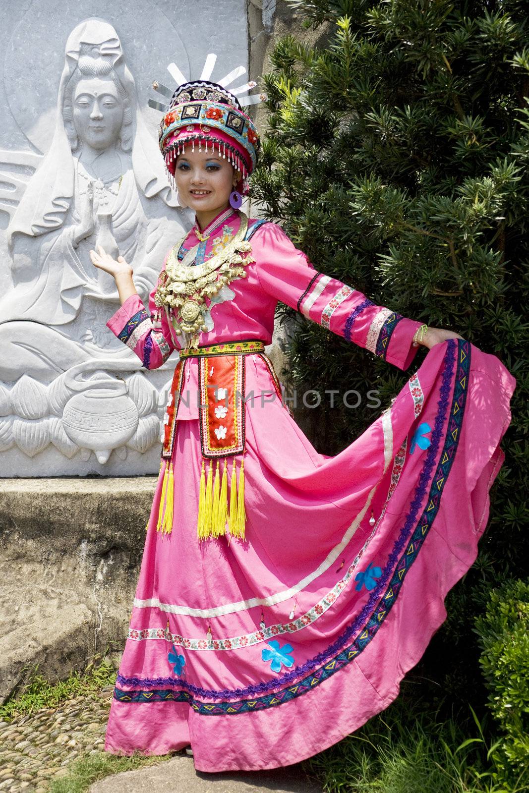 Image of a young Chinese girl in traditional ethnic dress at Yao Mountain, Guilin, China.