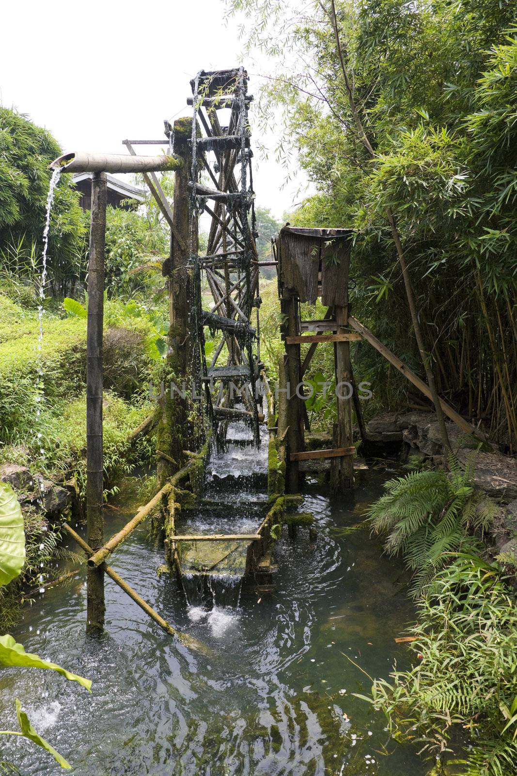 Image of a paddy farmer's water wheel irrigator at Guilin, China.