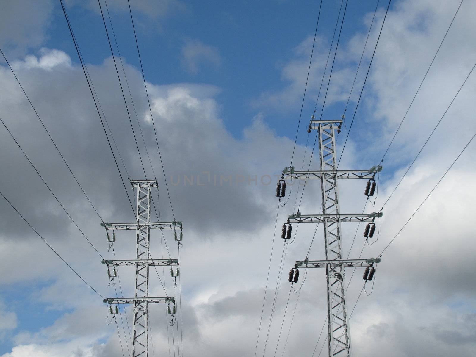 Electrical pillars and backgrond sky and clouds