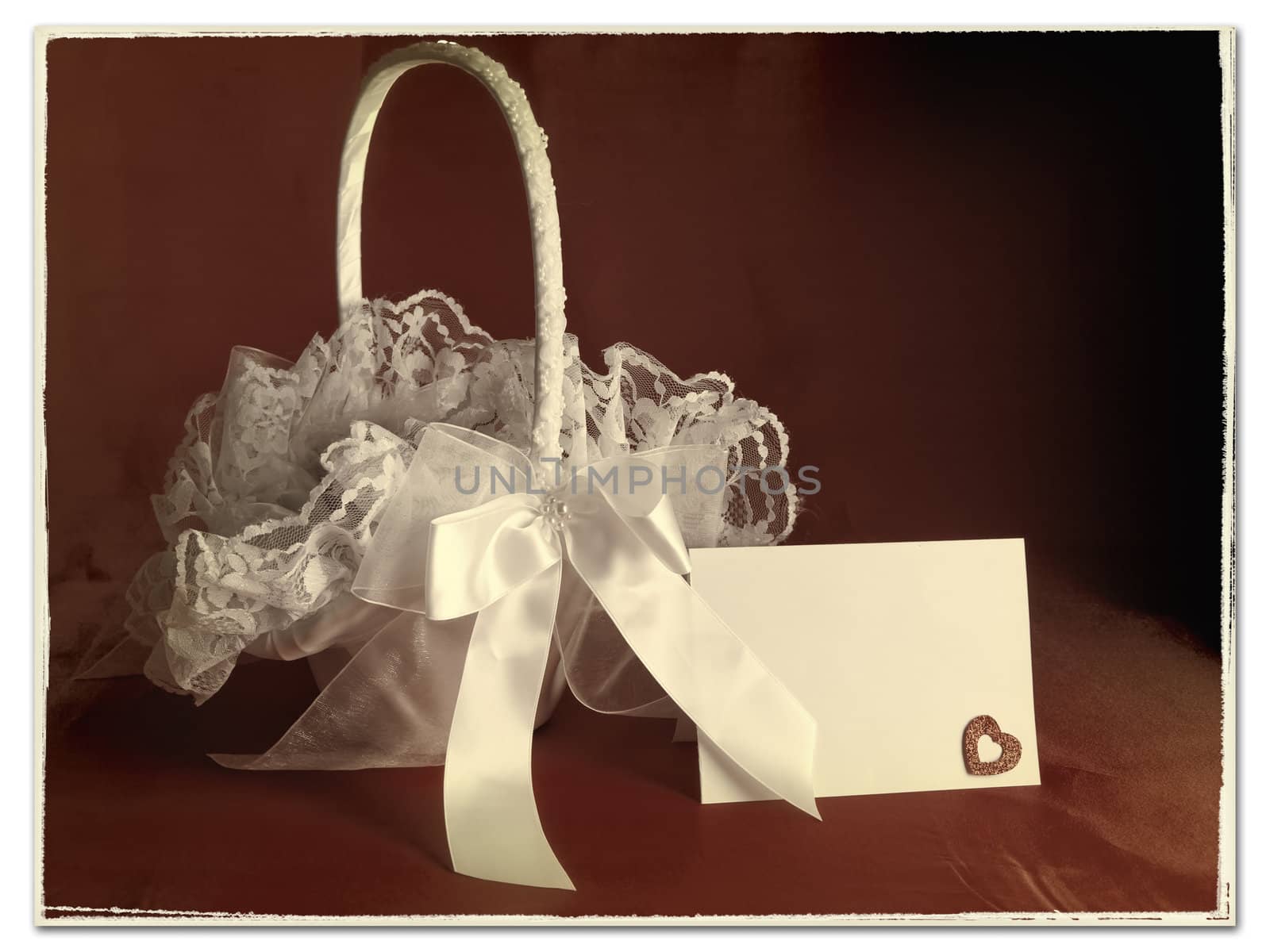 Old (stylized) image of bridal flower basket with invitation card