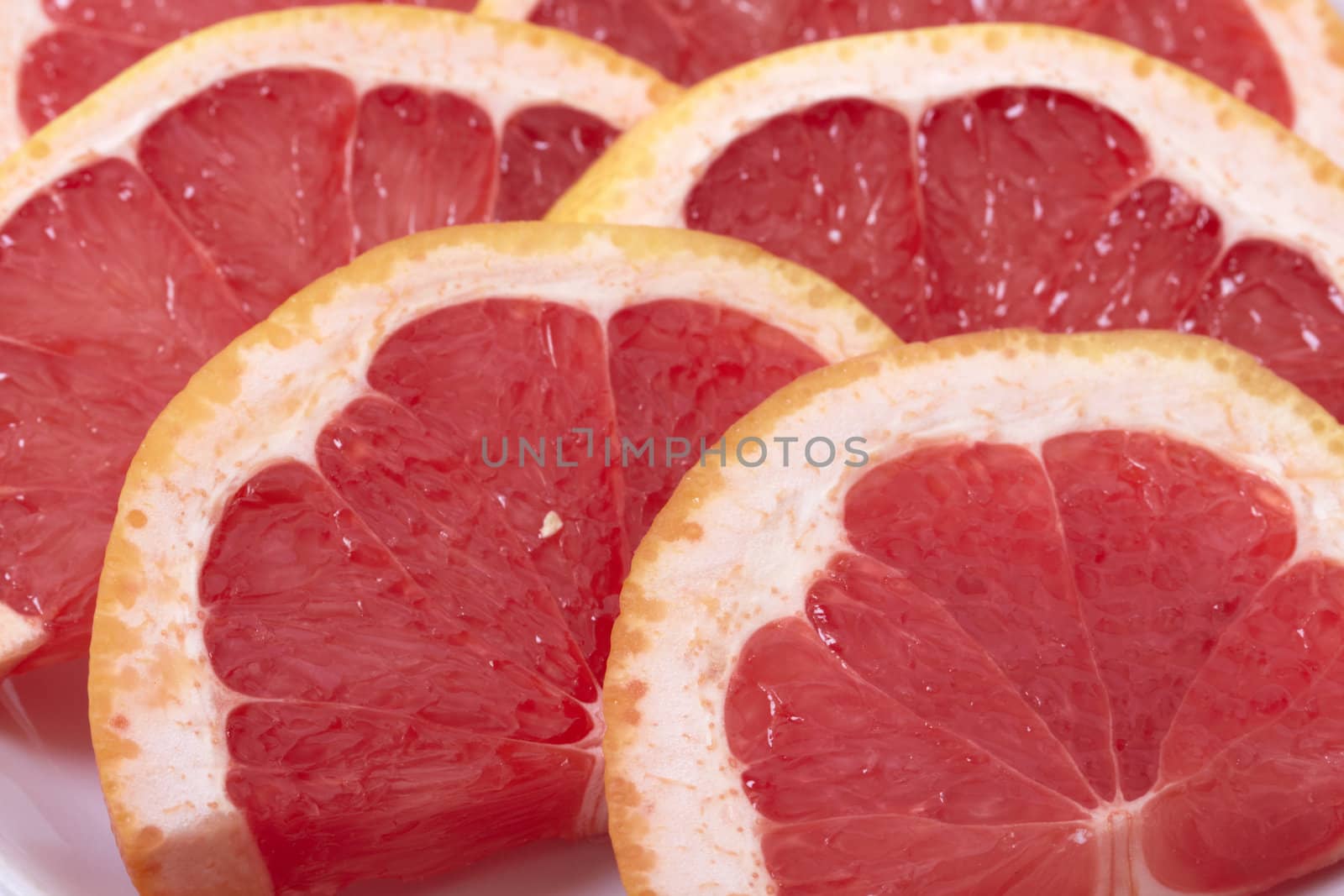 Sliced grapefruit background. Macro photo