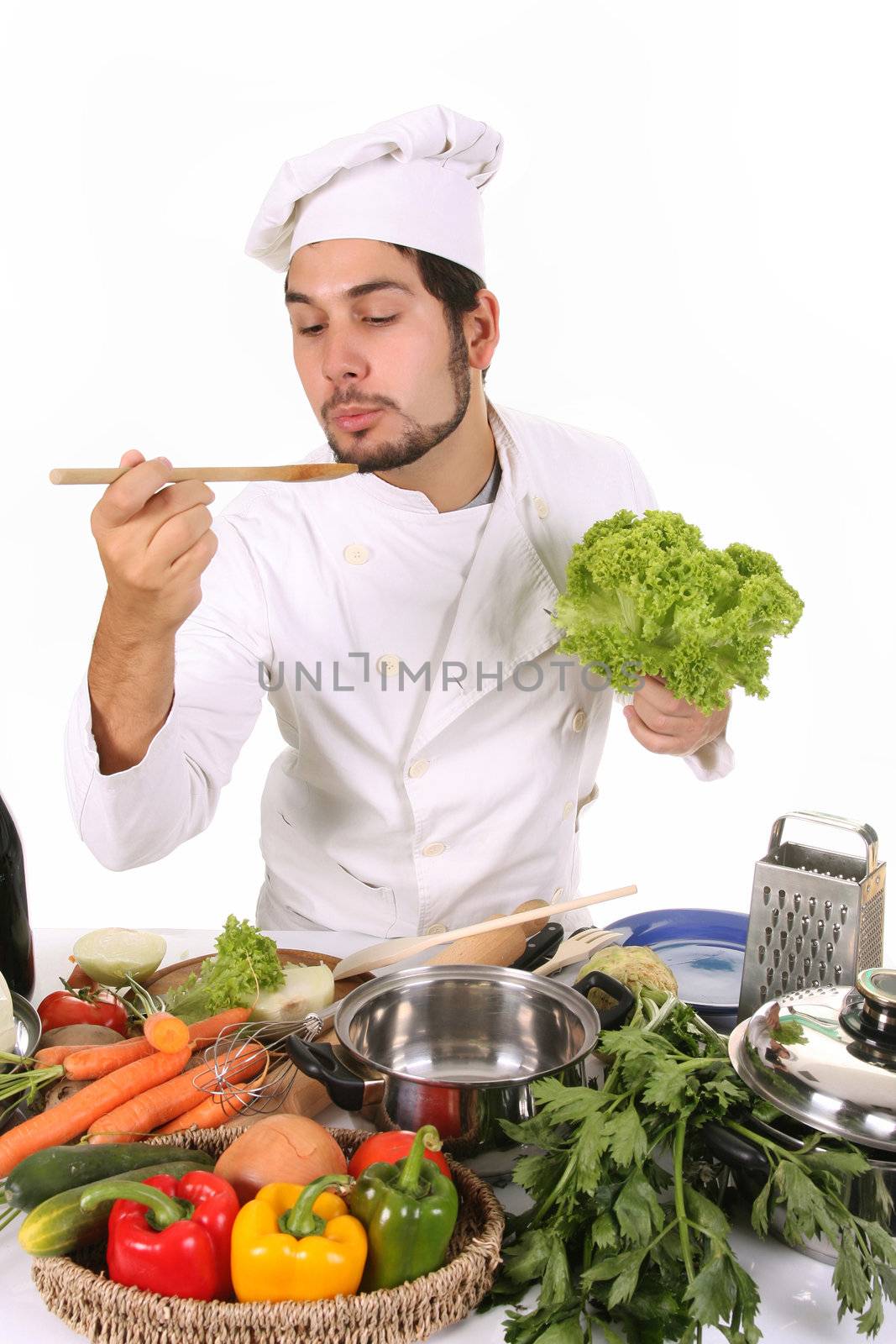 young chef preparing lunch on white background