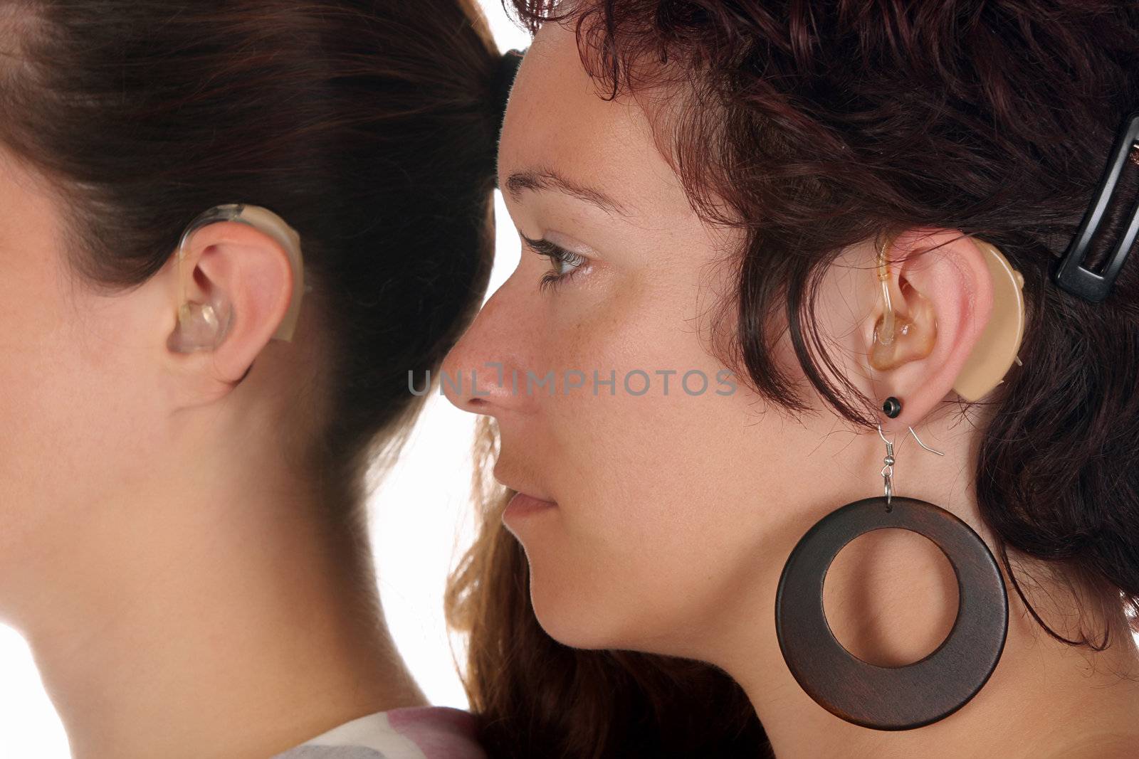 Beautiful young woman with Hearing Aid, closeup shot