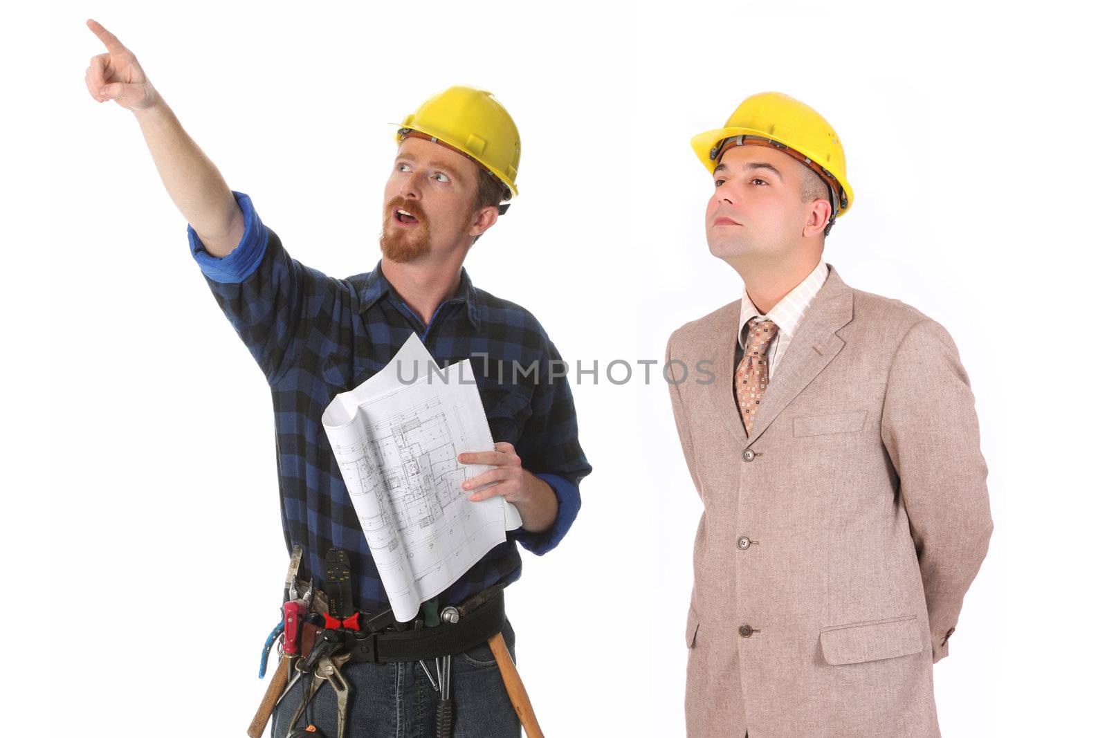 construction worker pointing on architectural plans and architect 