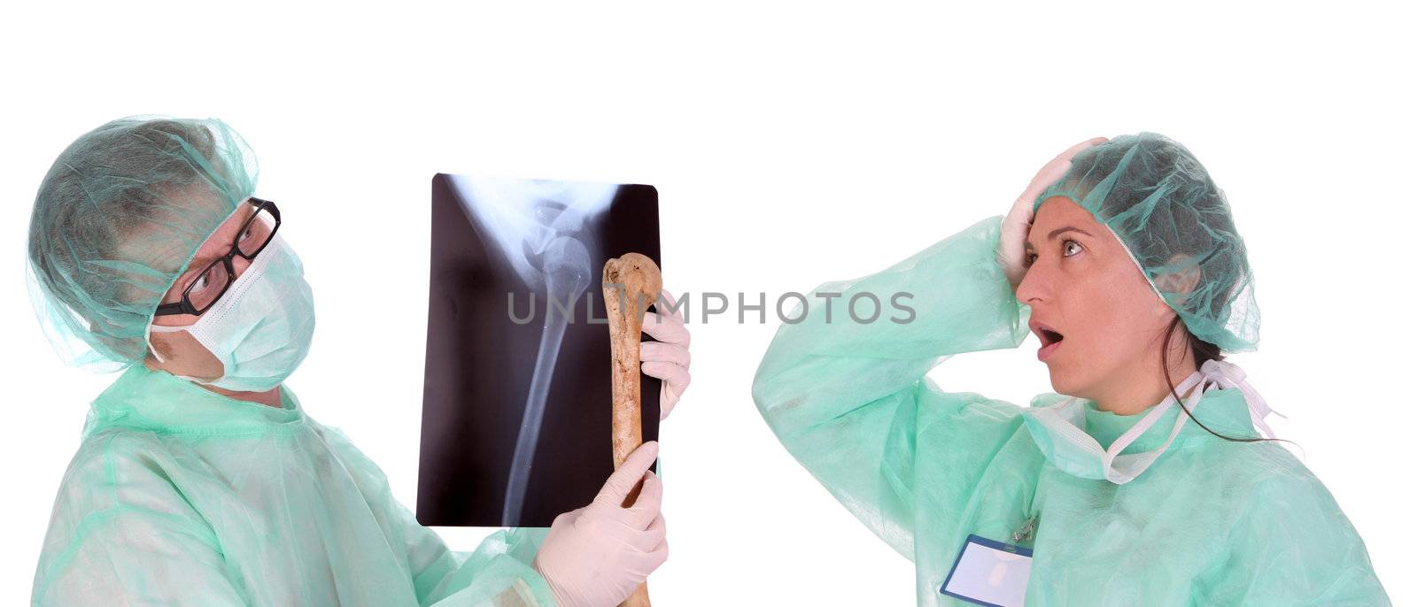 surgeon with xray and bone and shouting shocked healthcare worker