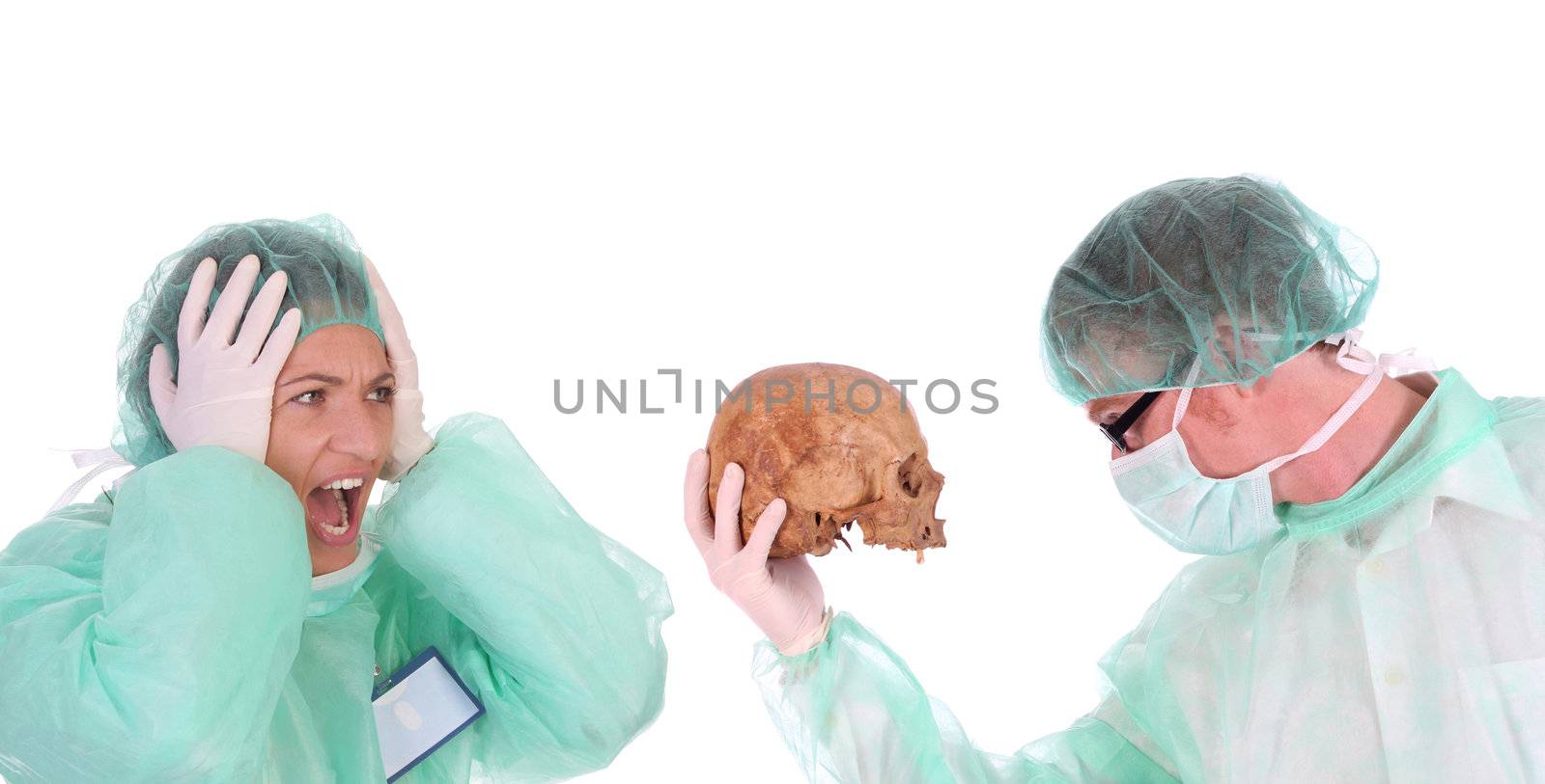 surgeon with skull and shouting shocked healthcare worker