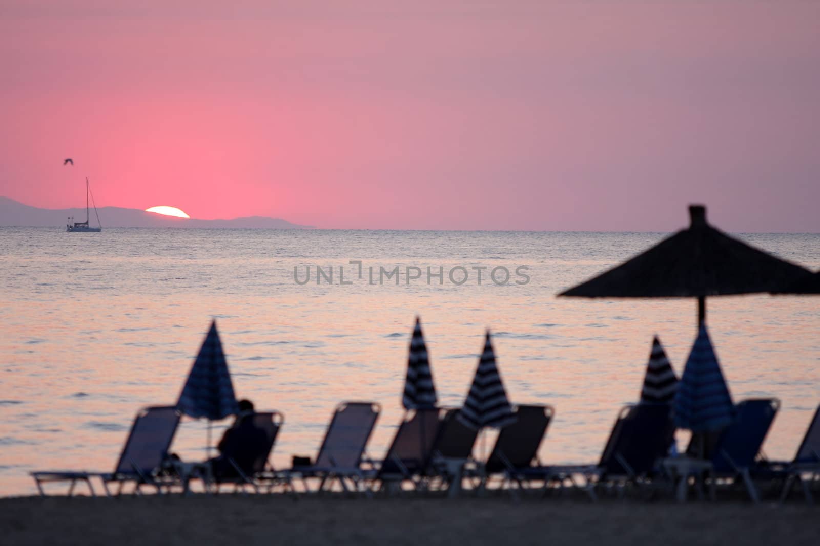 details of ocean and sunrise in Greece, focus on sun