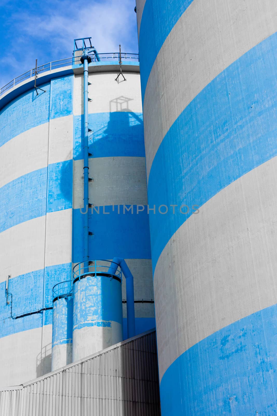 Storage depot facility with blue-white concrete silos.