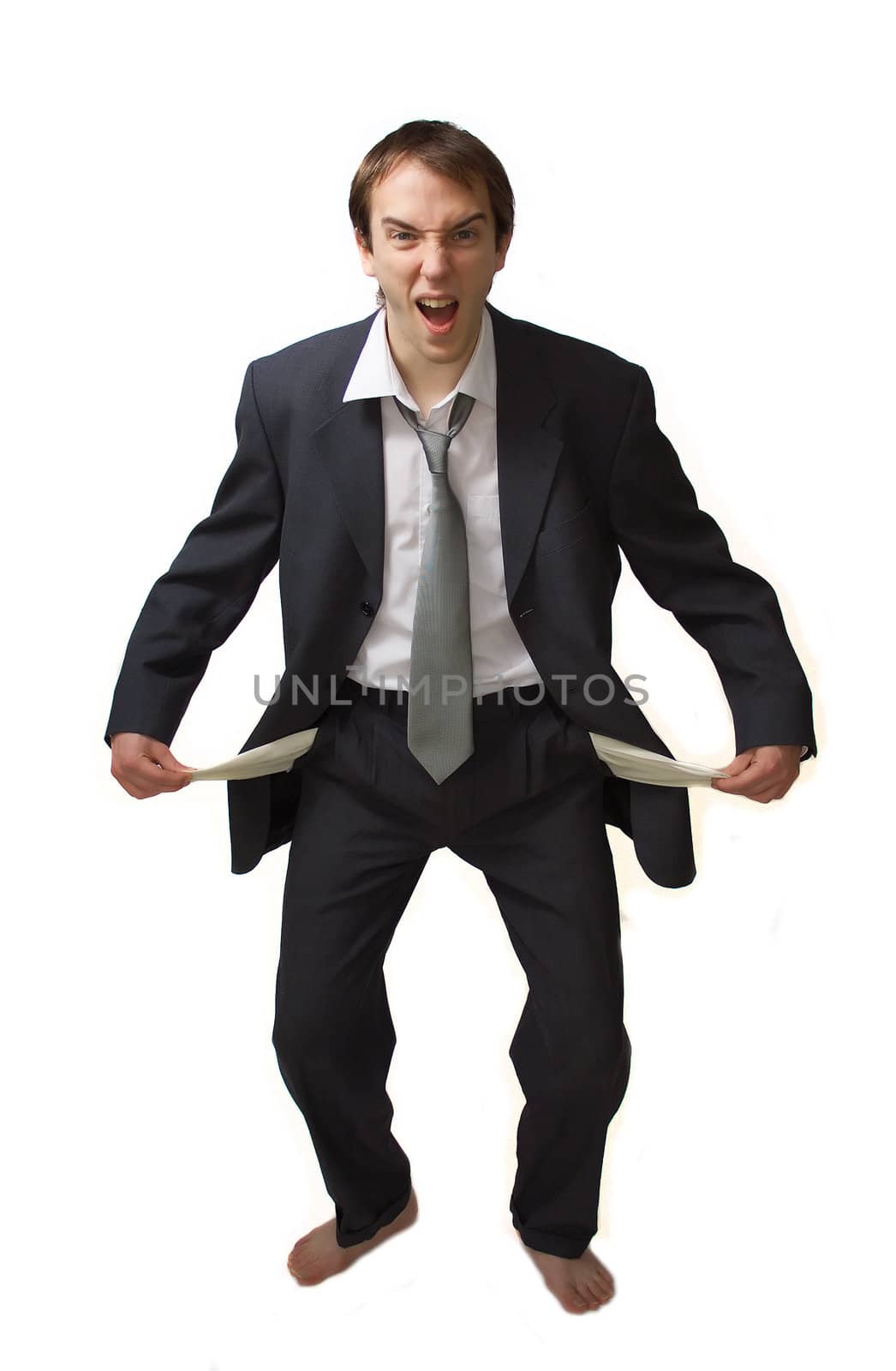 Young man shouts showing his empty pockets, isolated over white