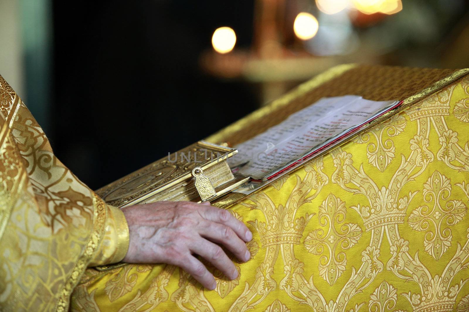 Priest with Bible on ceremony of wedding